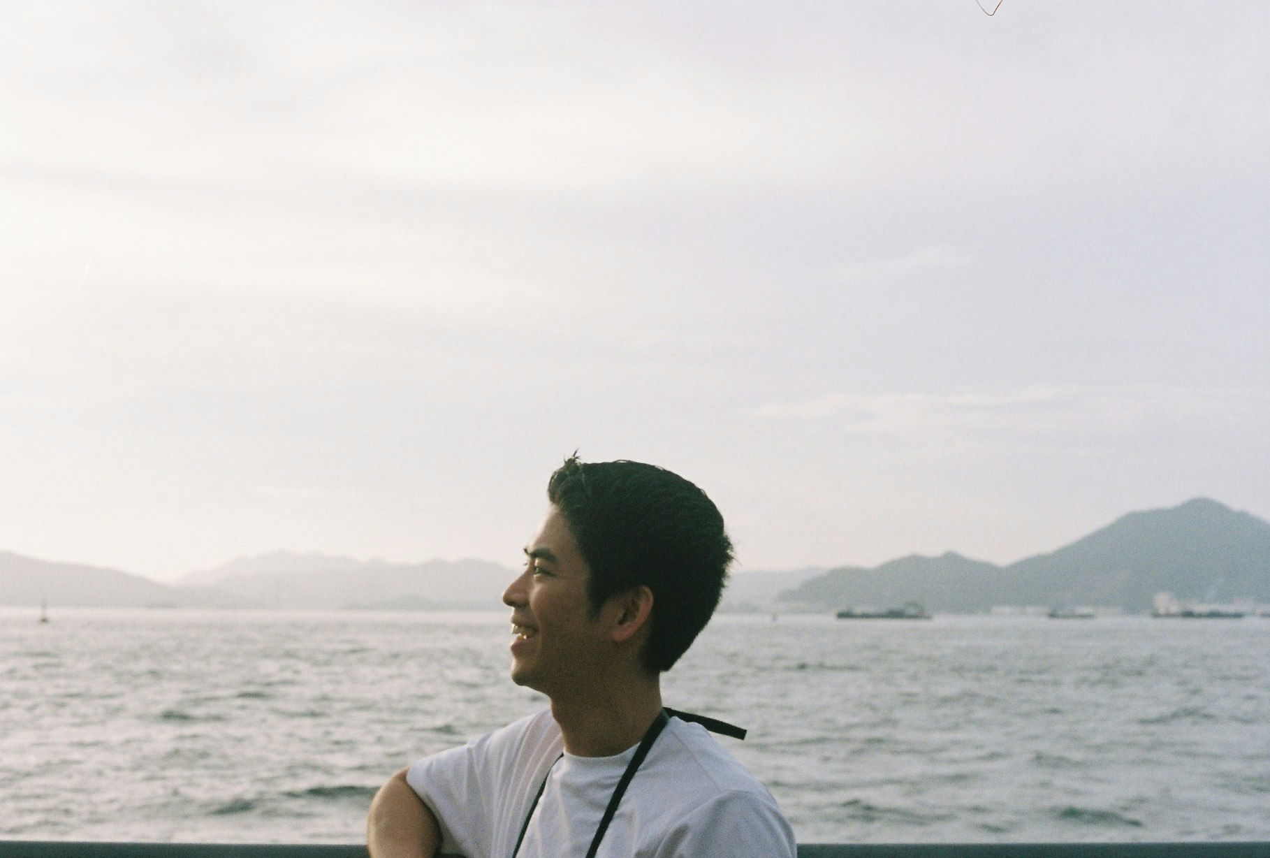 side profile of a man by the seaside