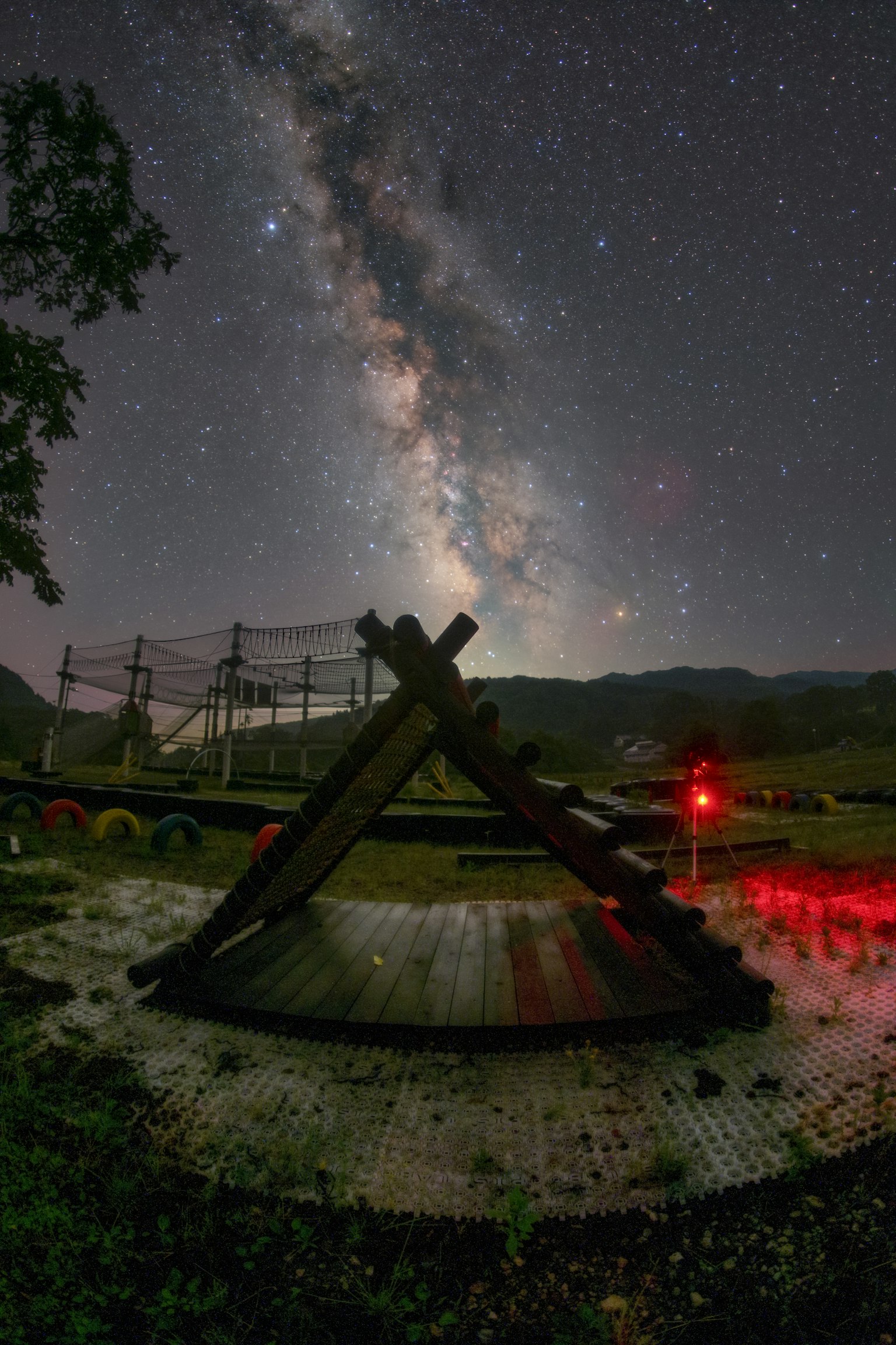 Wooden structure with the Milky Way and starry sky in the background