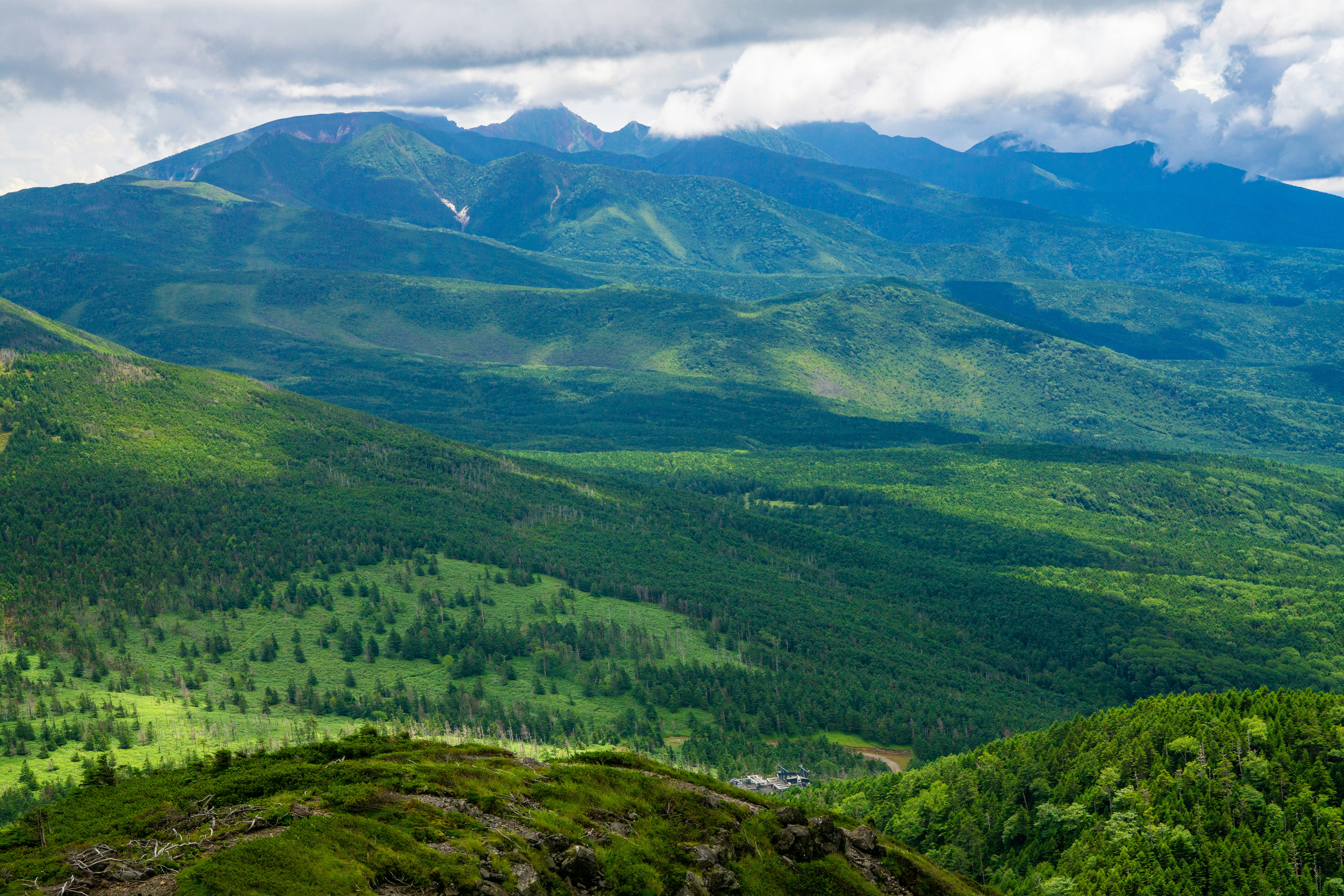 Lush green mountains and valleys showcasing beautiful scenery