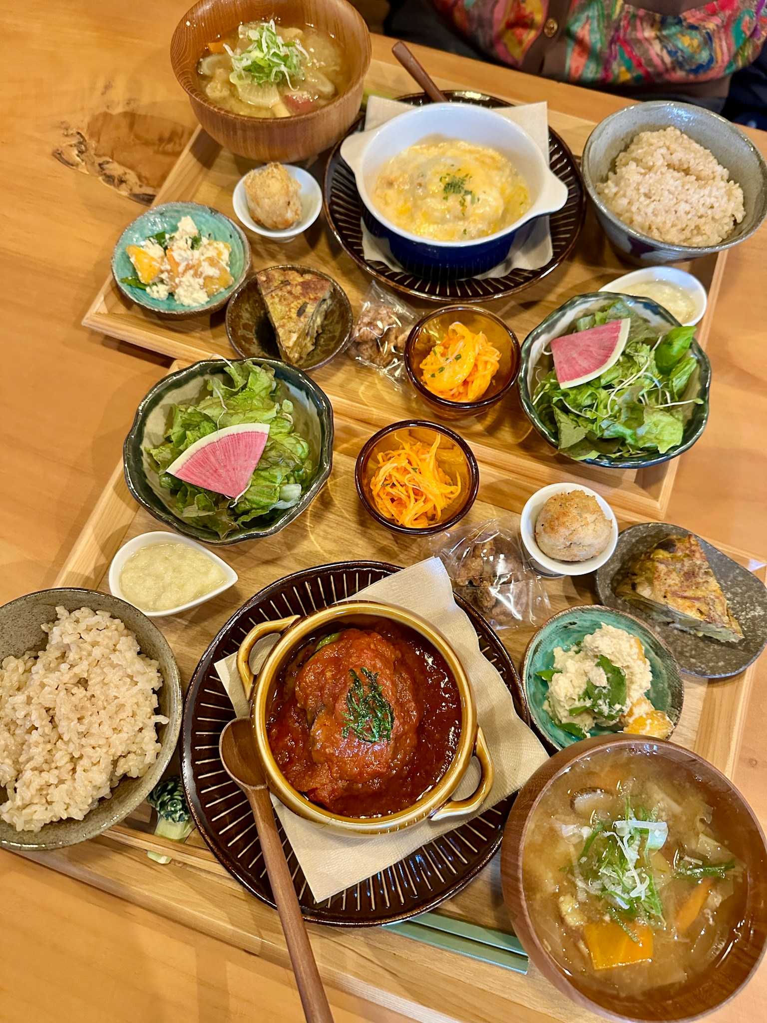 A vibrant assortment of Japanese cuisine displayed on a wooden tray