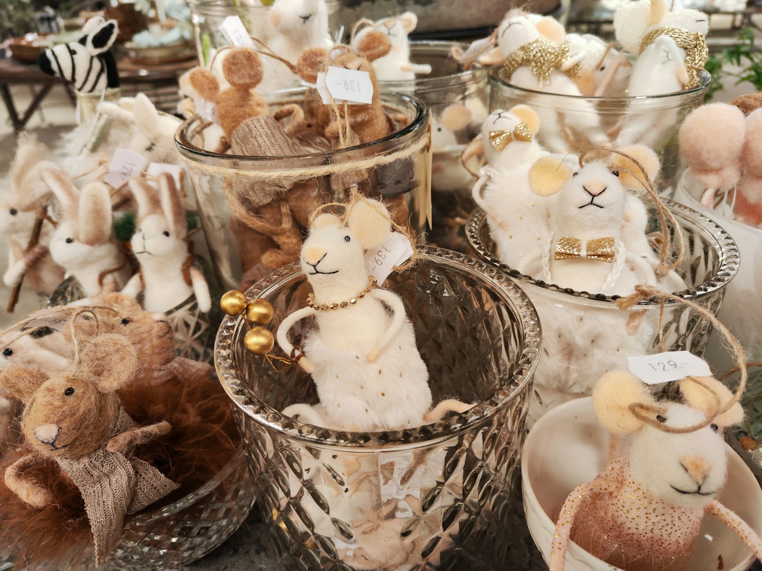 Various yarn rabbits and mice decorations in baskets