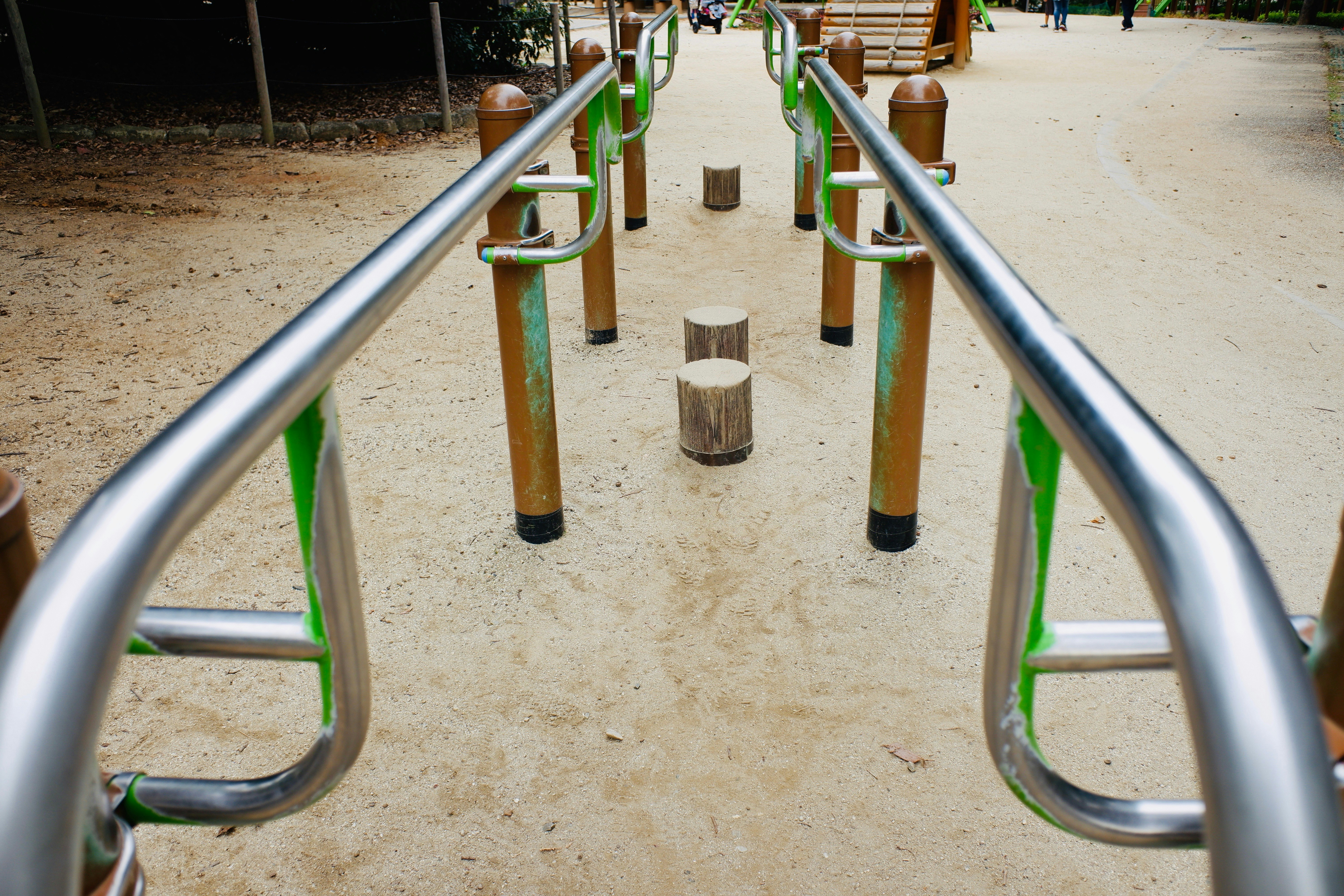 playground slide handrails and sand area
