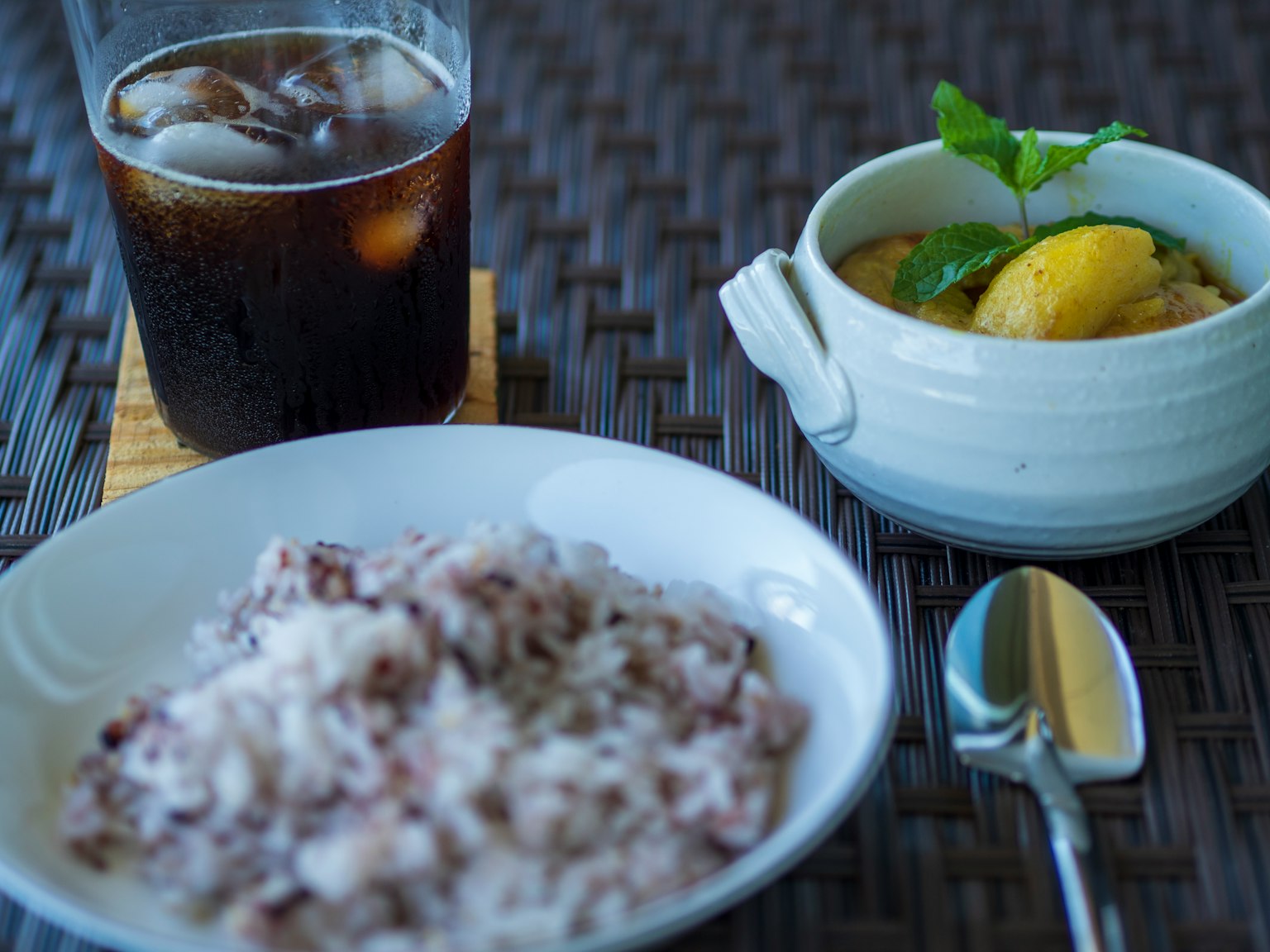 A setting with black rice and dessert