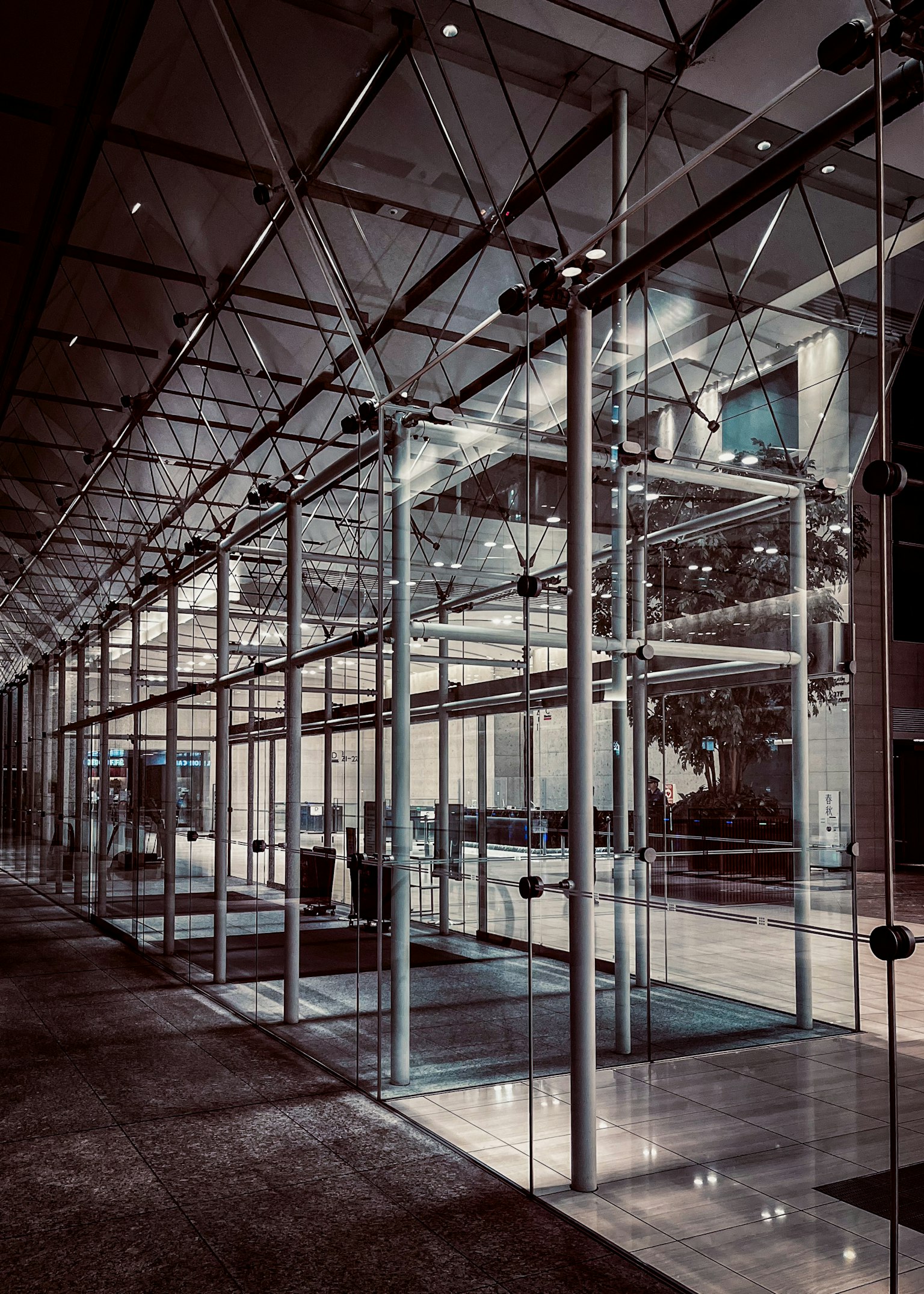 Entrance of a modern building with glass walls and sleek design