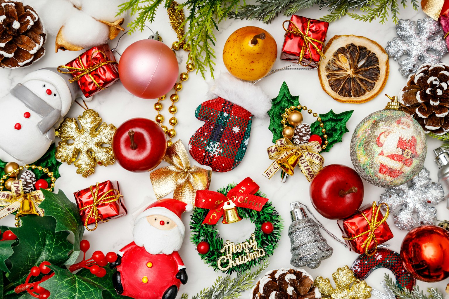 A festive arrangement of Christmas decorations and gifts
