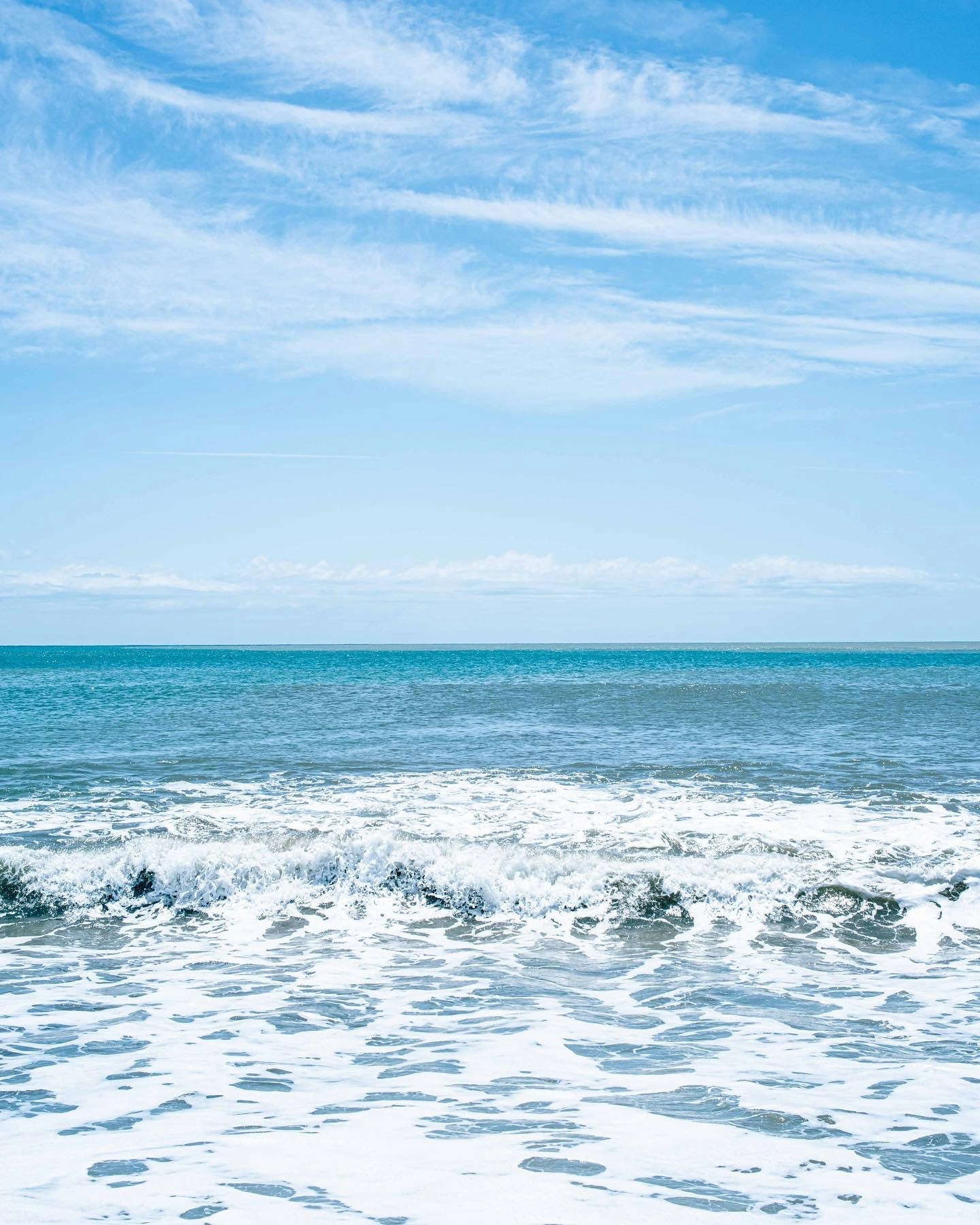 Pacific Ocean seascape with blue water and rolling waves