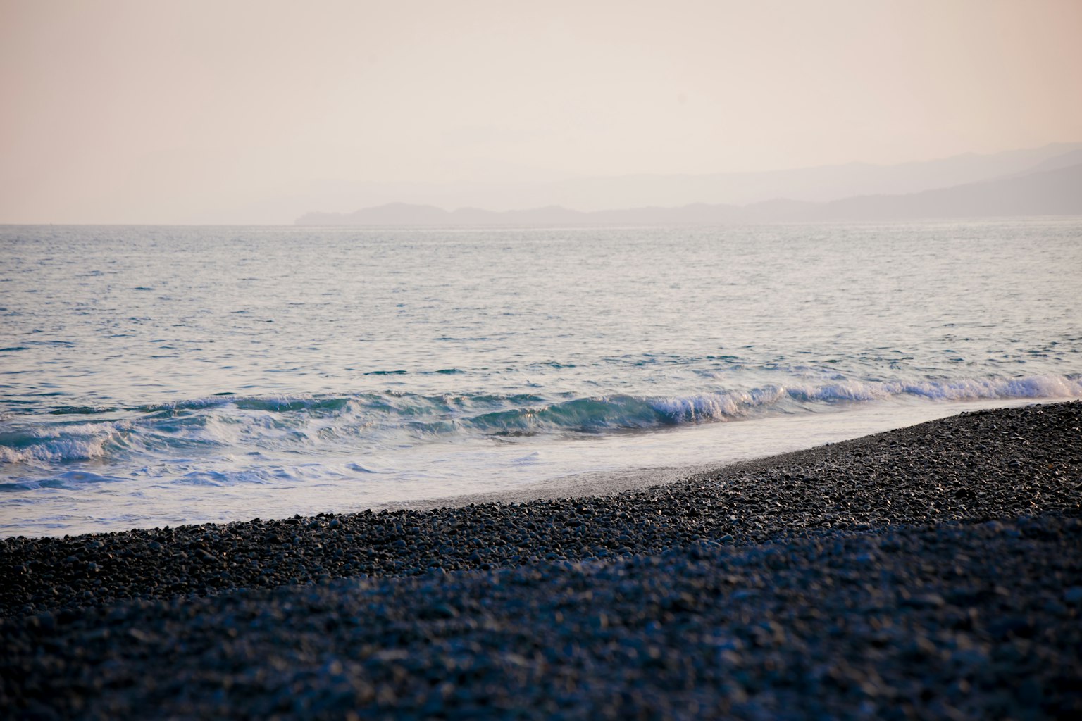 Calm sea with pebbly beach scenery