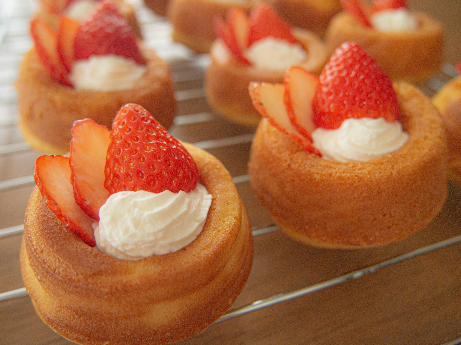 Baked dessert topped with strawberries and whipped cream