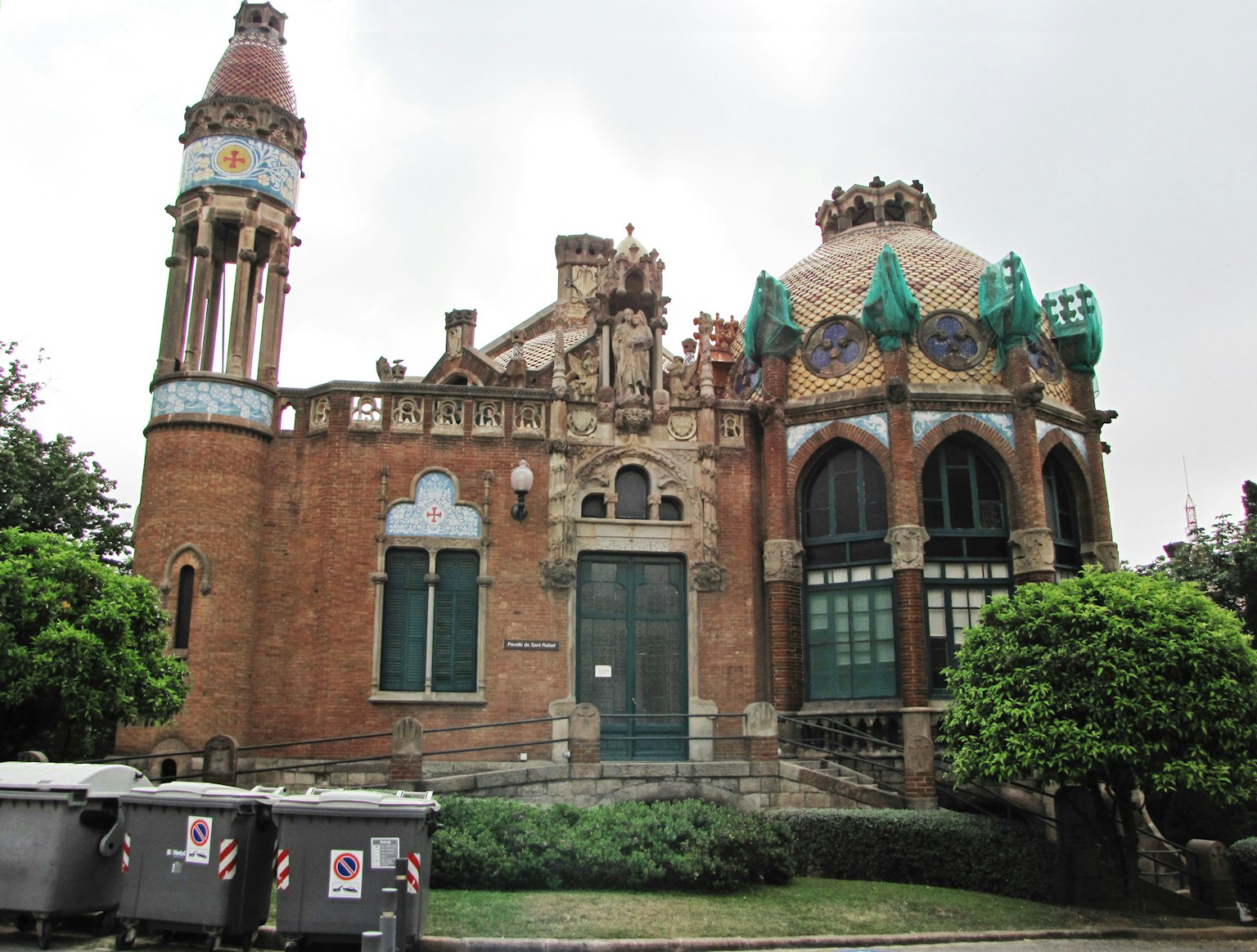 Exterior of a colorful modernist building with intricate tile work