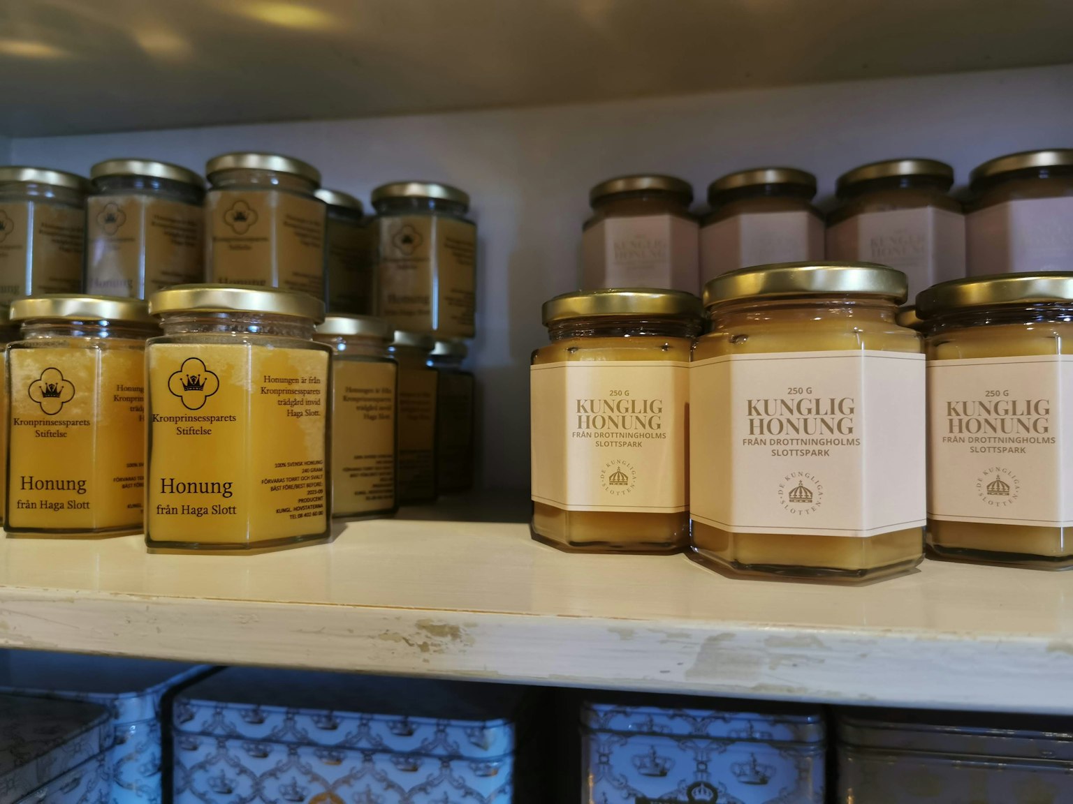 Shelves displaying various aromatic candle jars