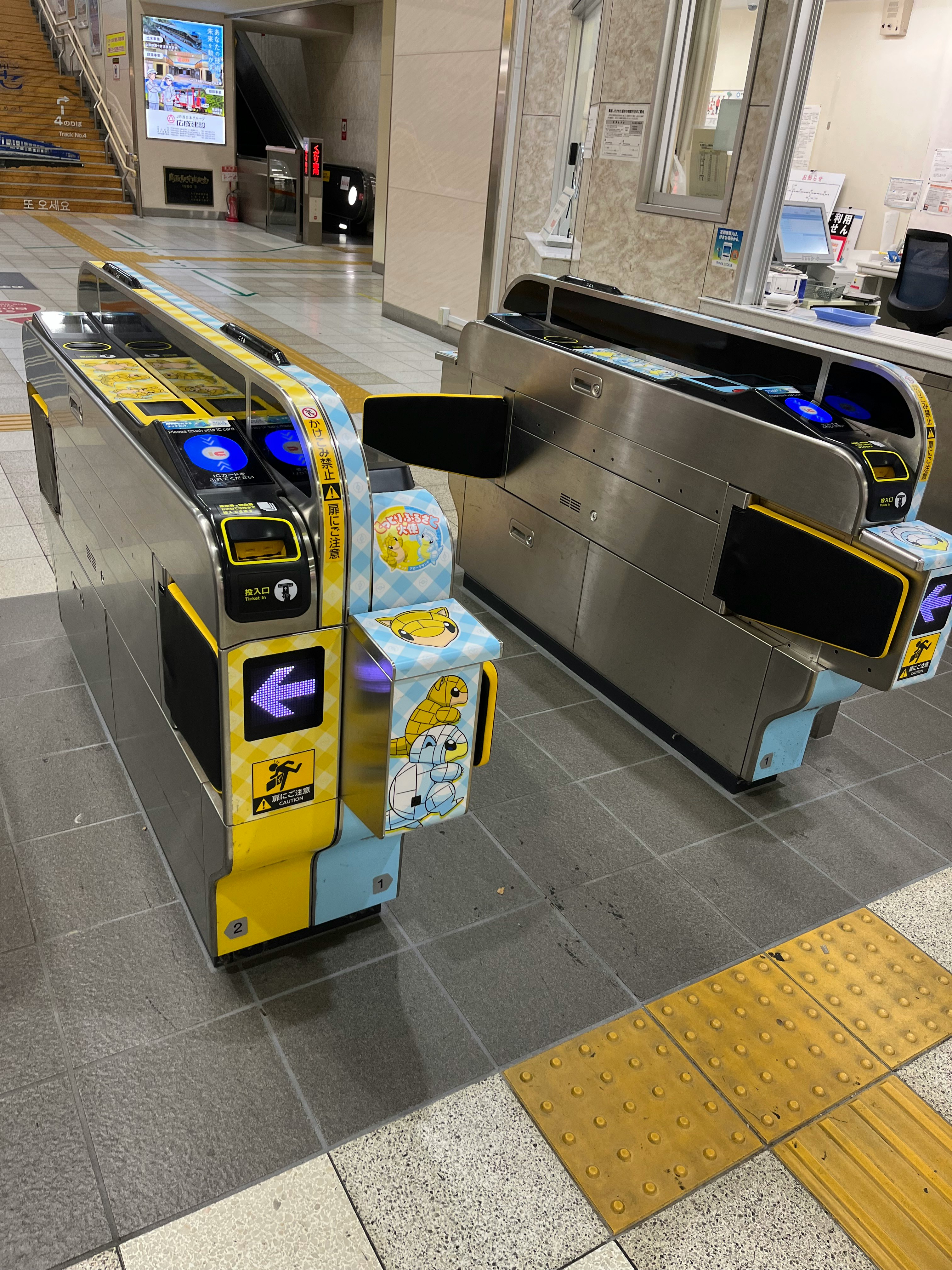 station entrance gate and automated ticket gates in a corridor