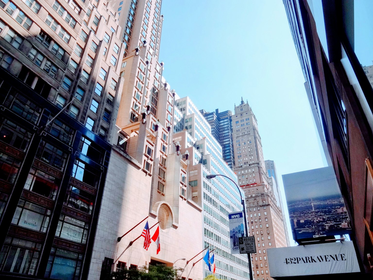 City street view featuring skyscrapers and clear blue sky