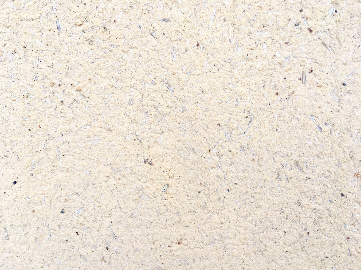 Textured cream-colored surface with subtle variations