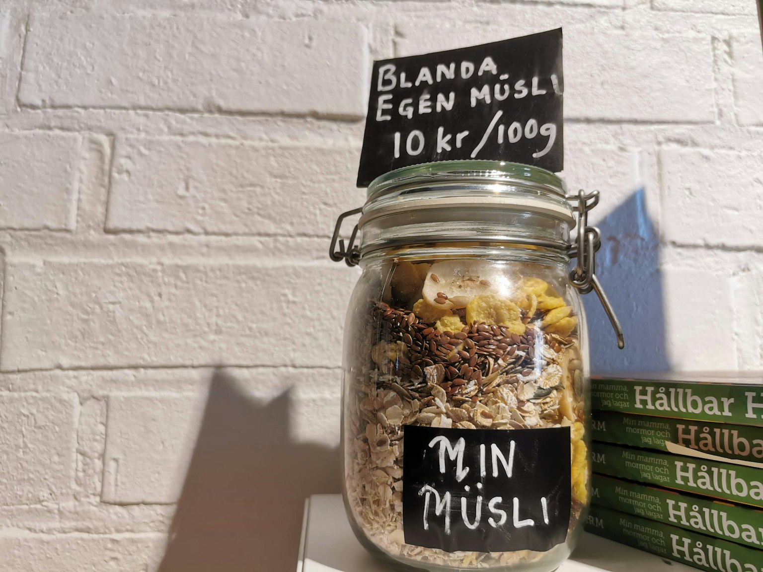 A glass jar filled with muesli and a Swedish sign