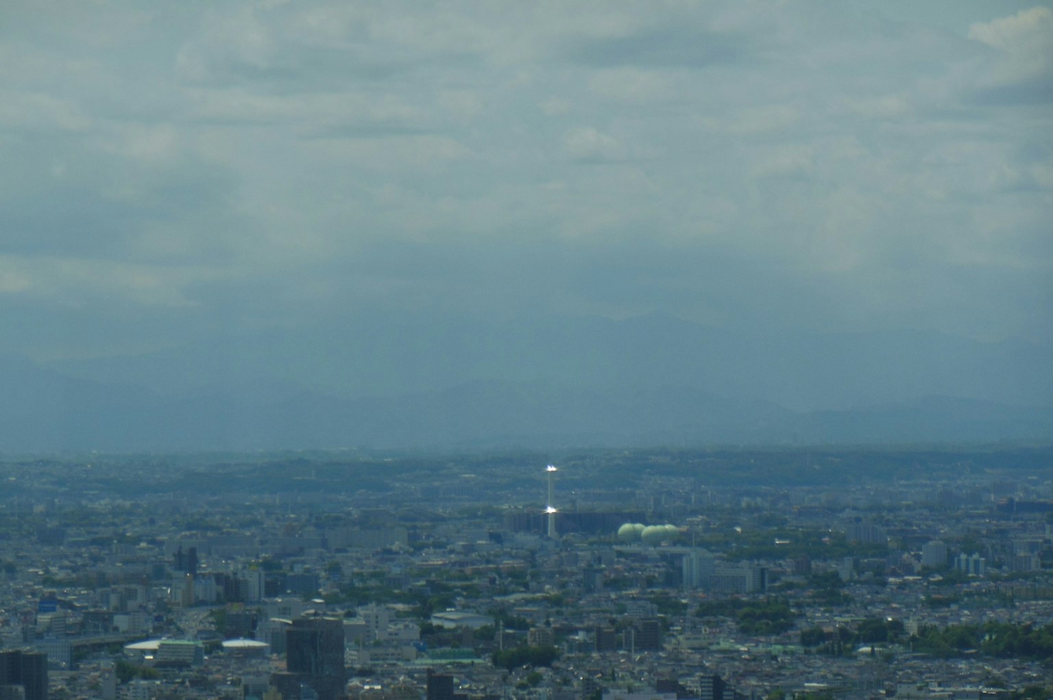 Panoramic view of Tokyo with urban landscape and cloudy sky