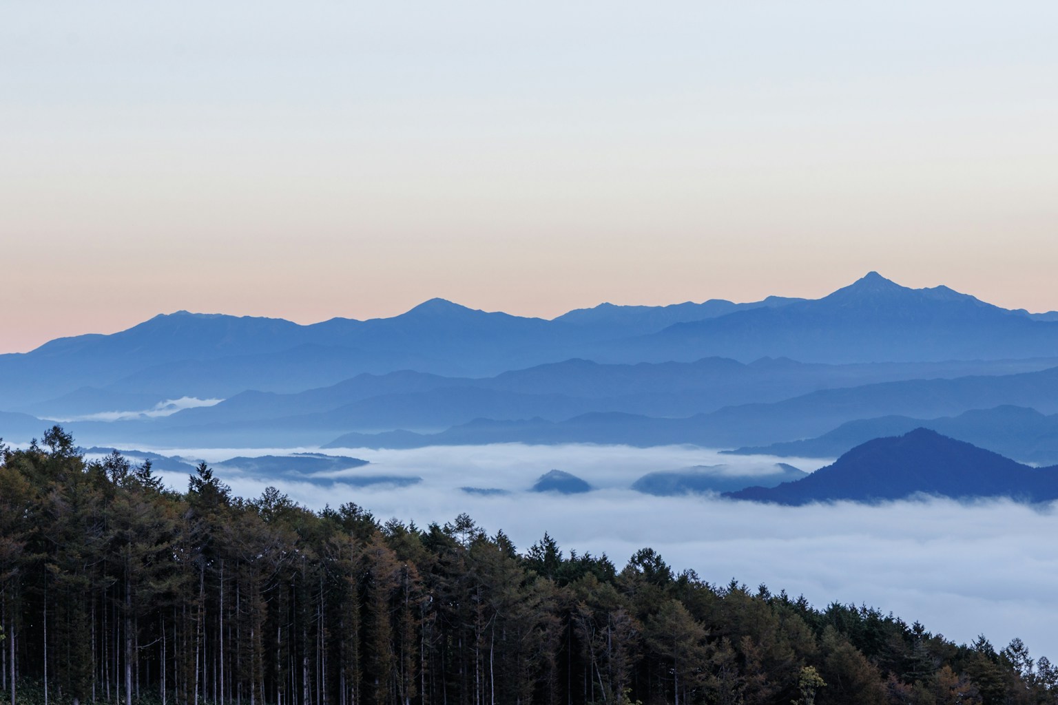 Beautiful landscape of misty mountains and blue sky