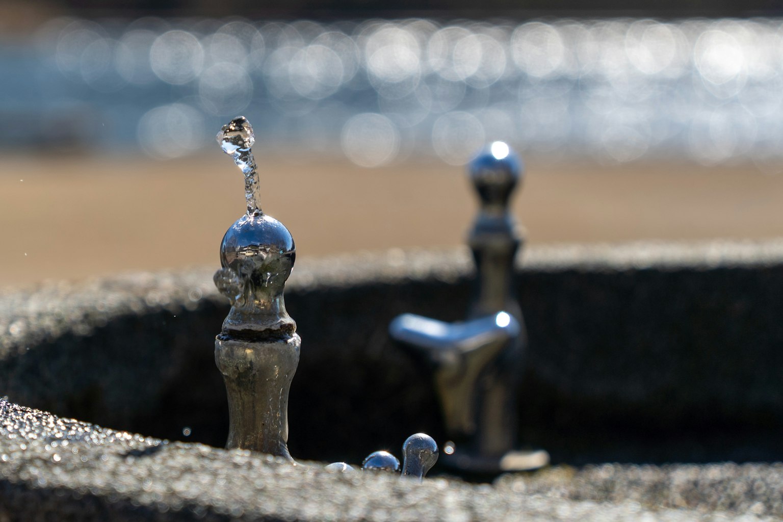Metal drinking fountain spout with water jet