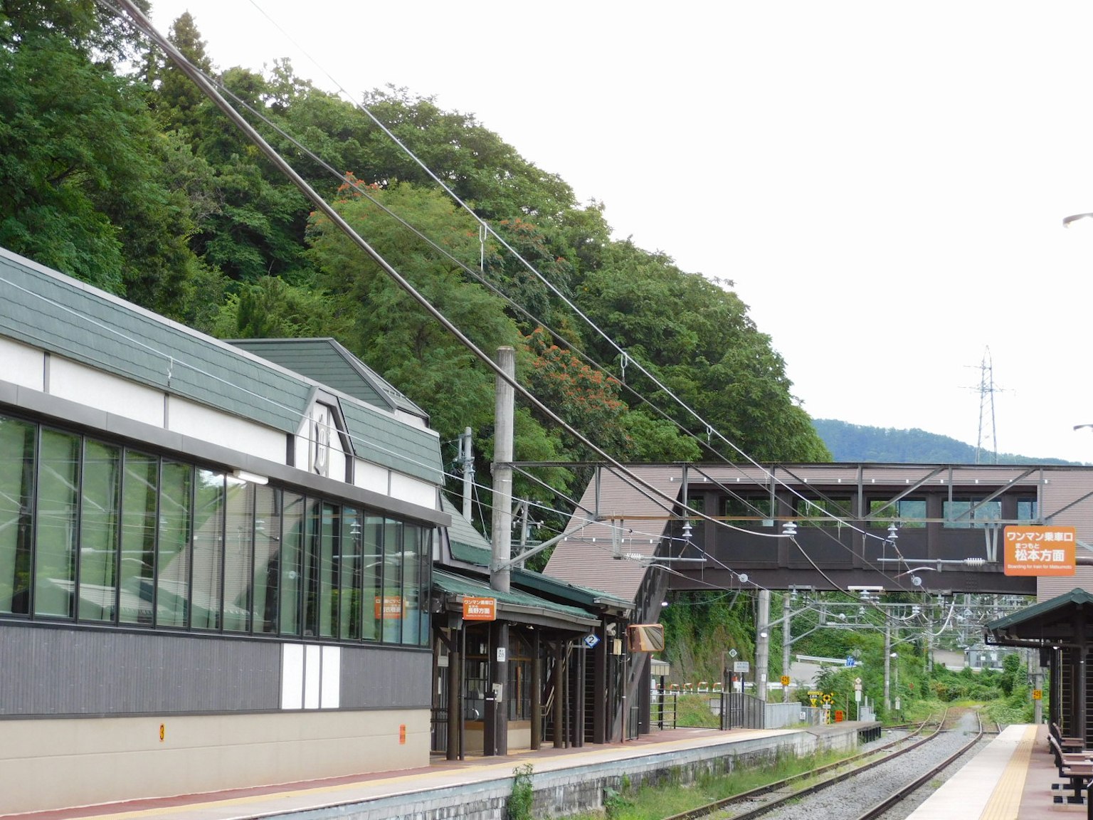 Train station platform with surrounding greenery