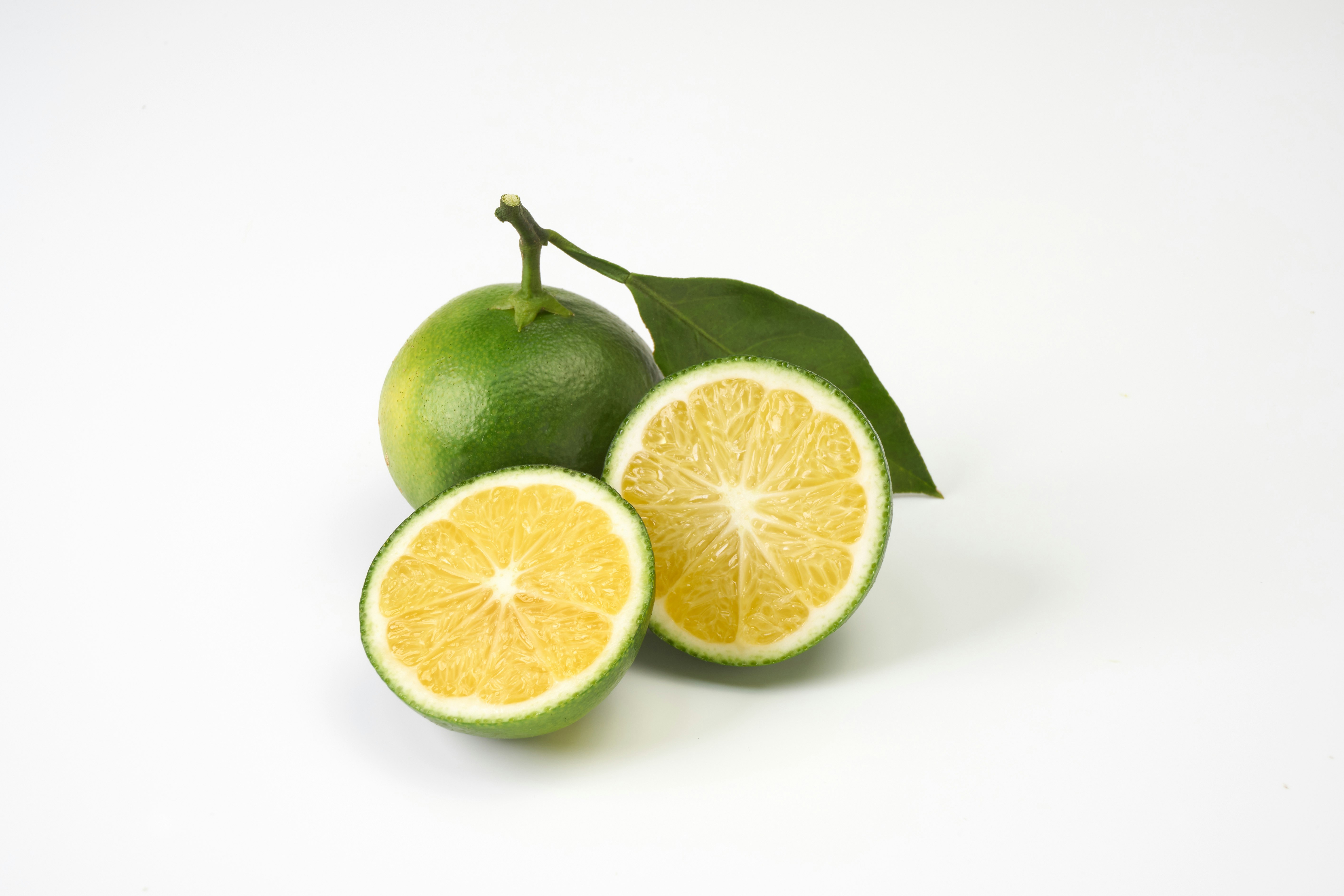 Lime and lemon on a white background