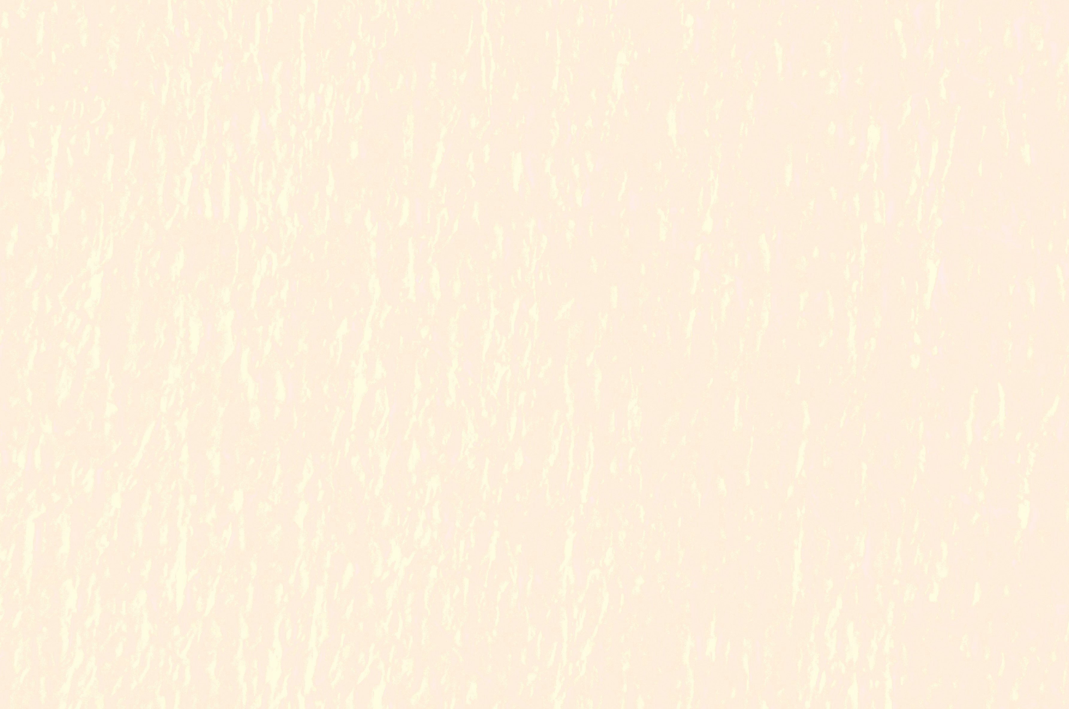 淡いベージュの背景に細かな質感の光