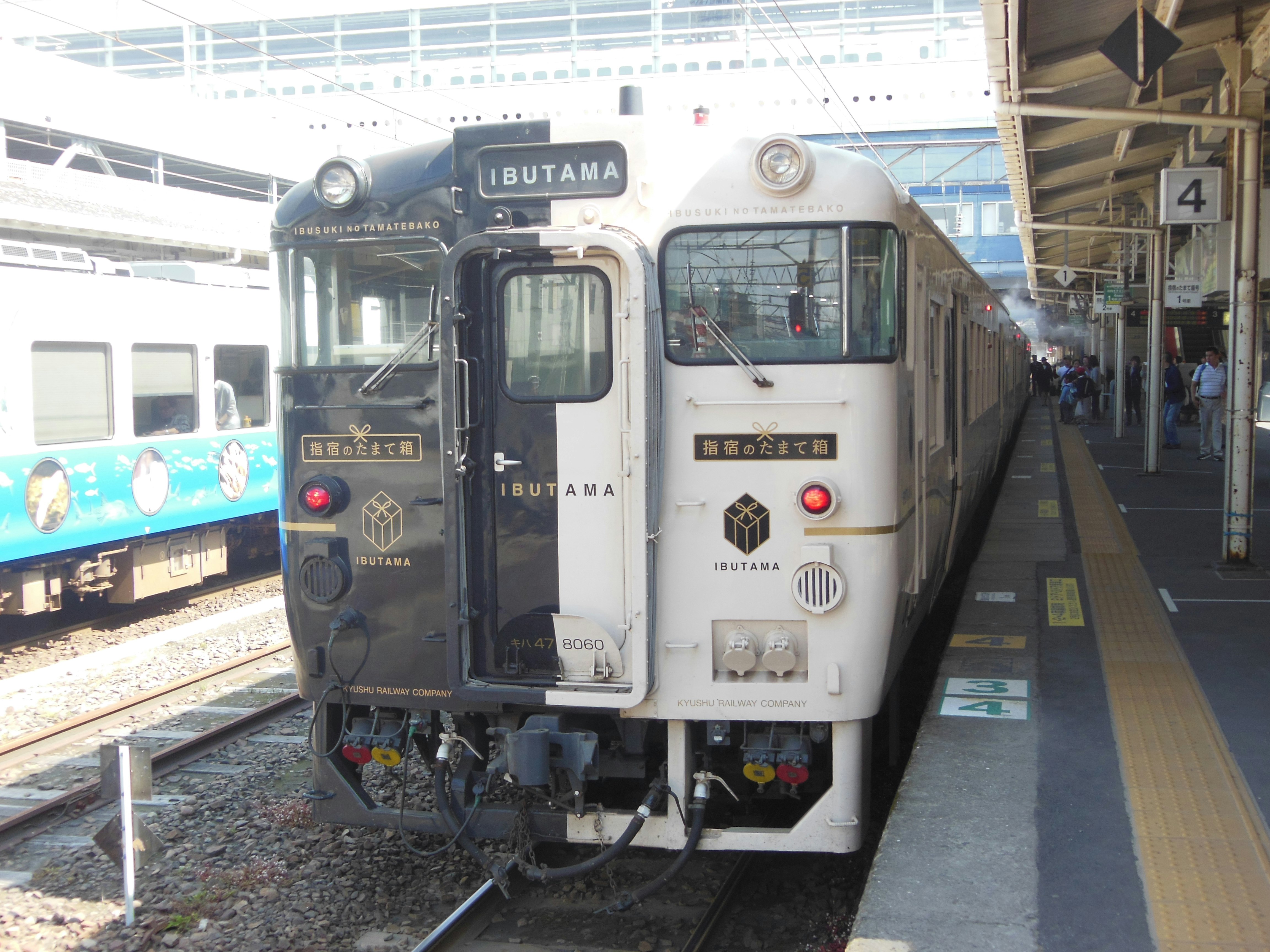 front views of trains lined up at a station platform