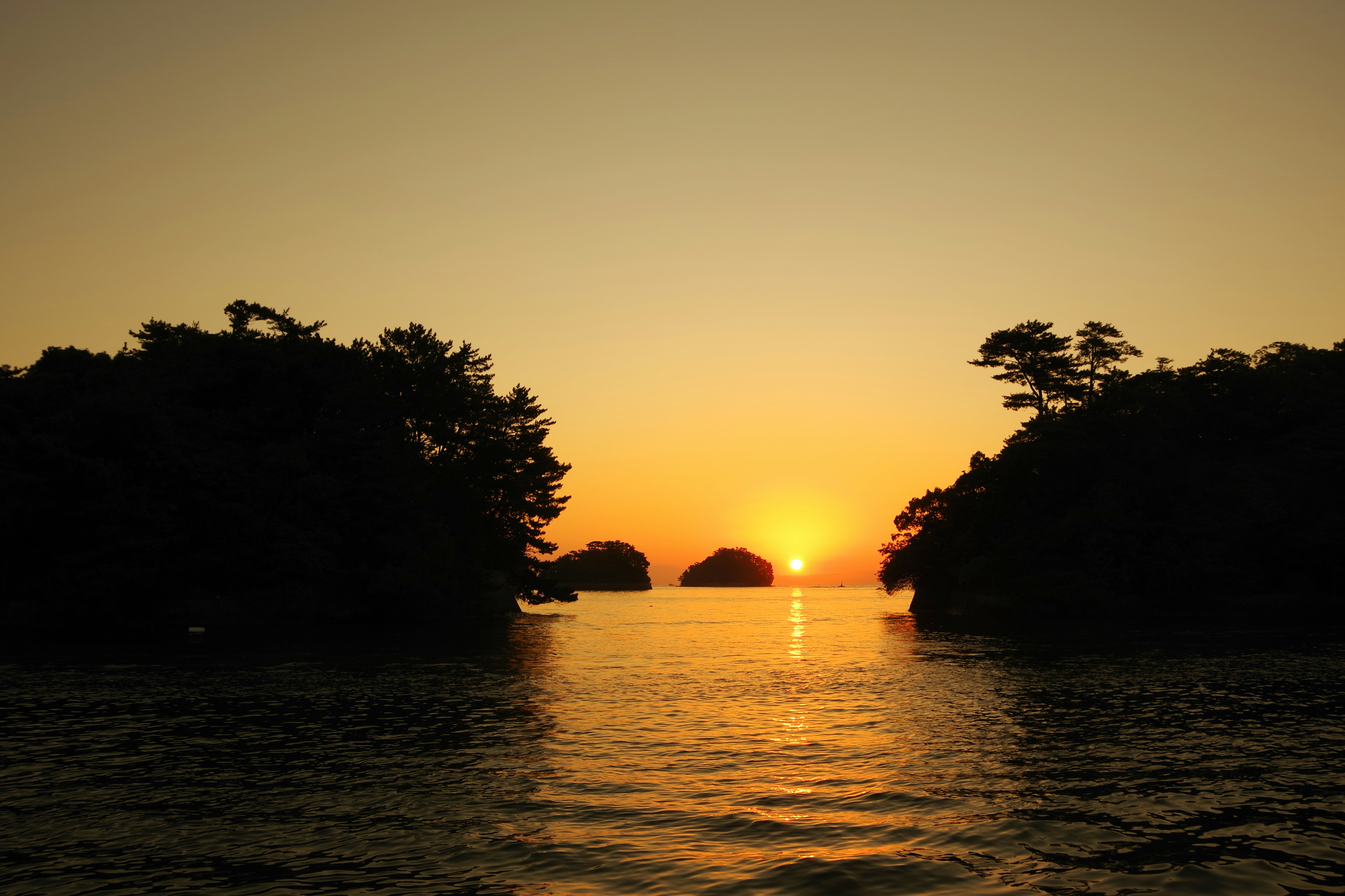 tranquil riverside landscape at sunset