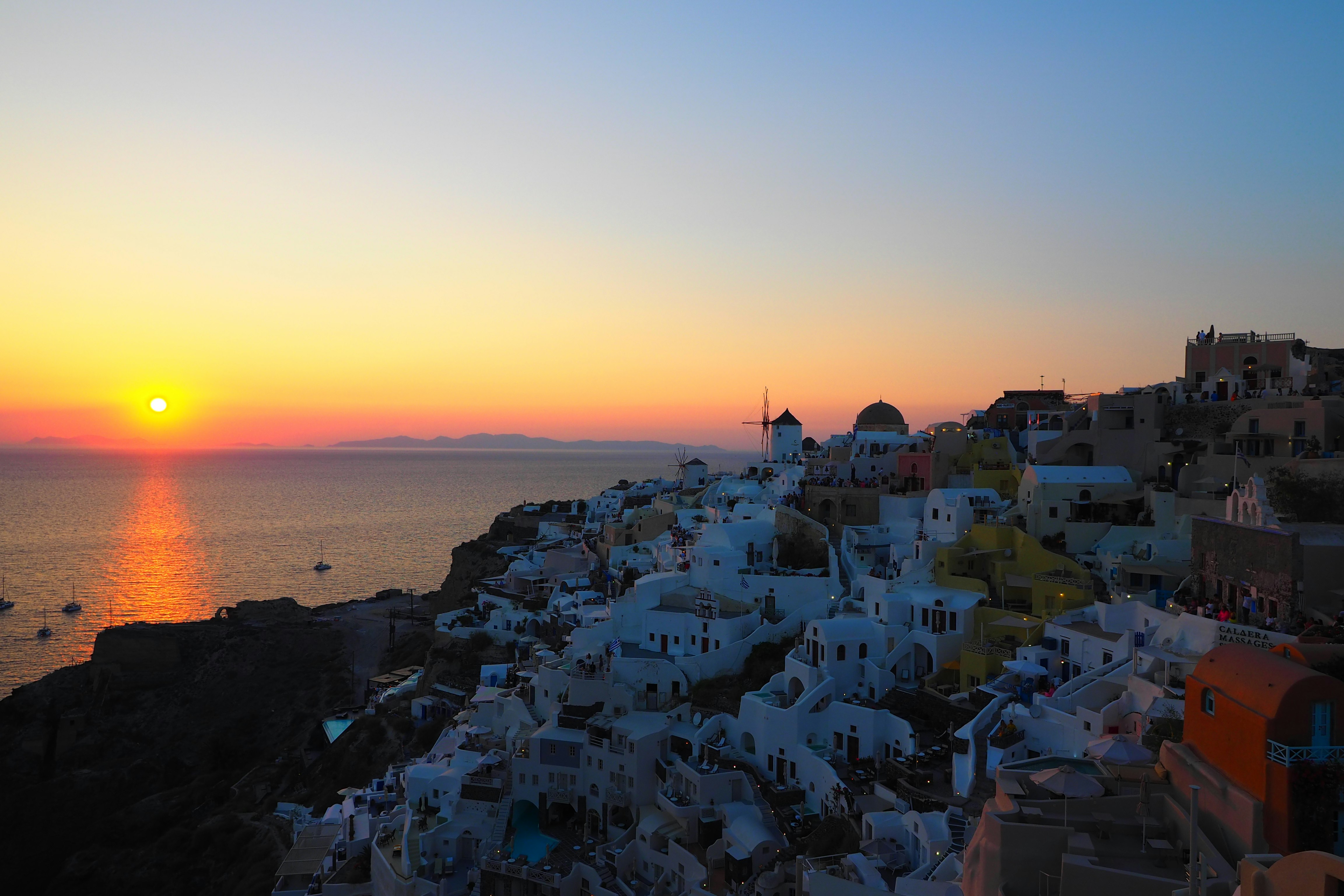 Seaside townscape with white buildings at sunset