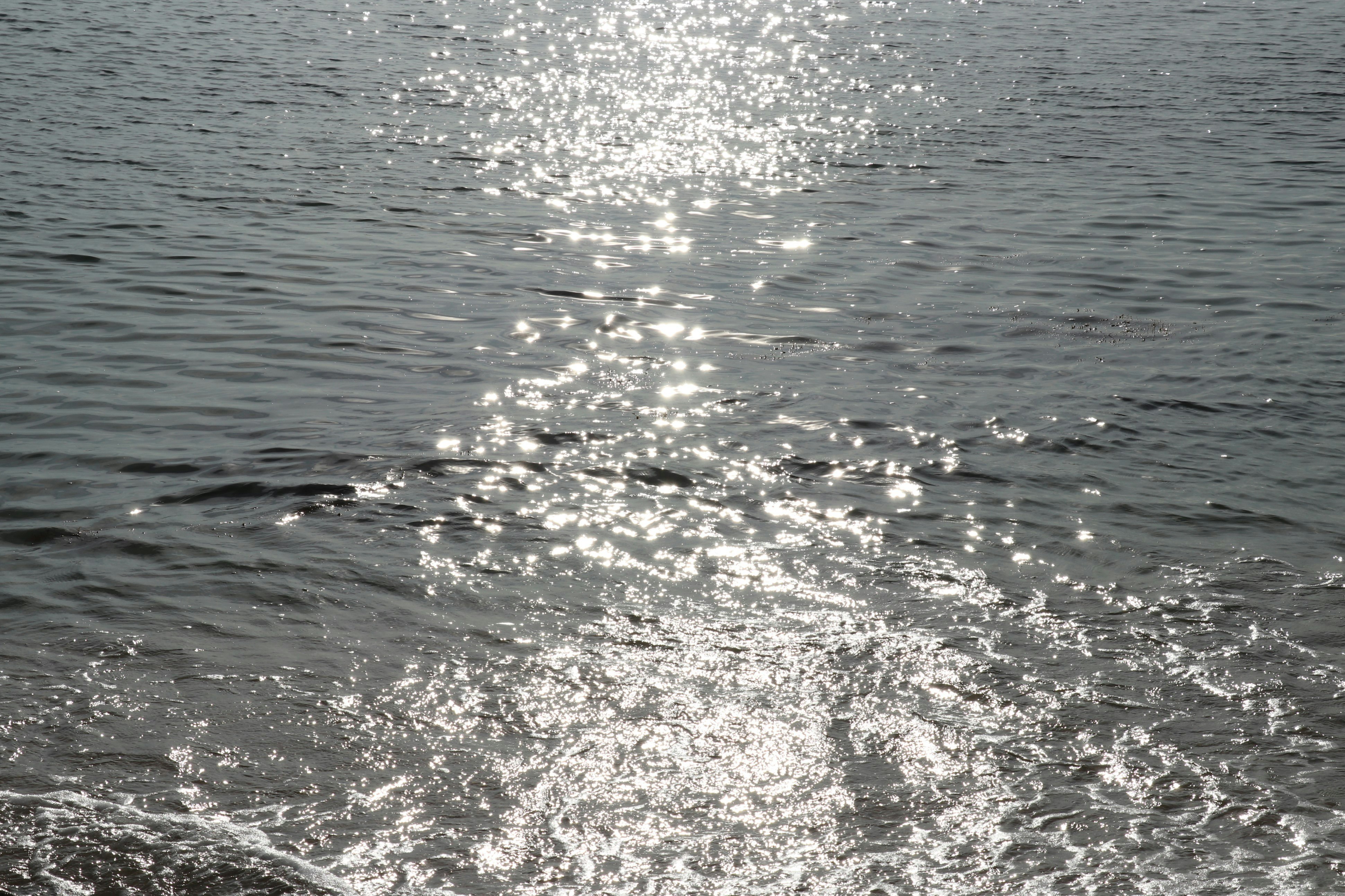 sparkling ocean waves on the water surface