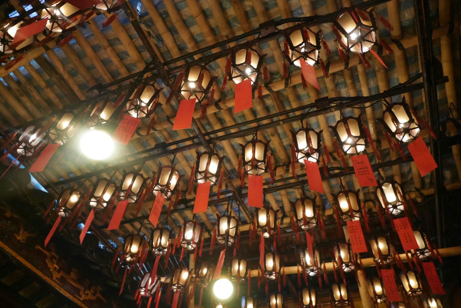 Ceiling adorned with red lanterns and warm lights