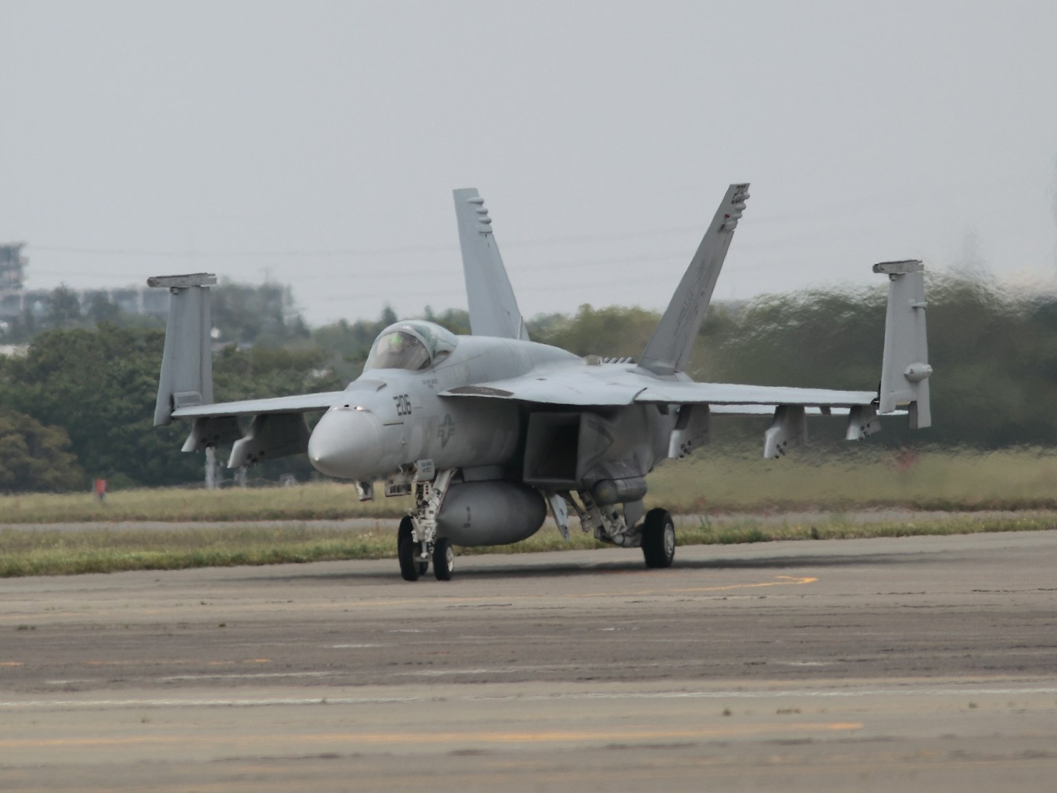 Image of a fighter jet on an airport runway