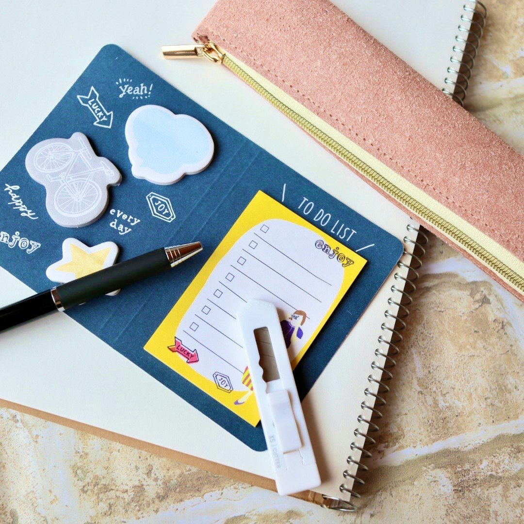 desk still life with sticky notes and a to-do list