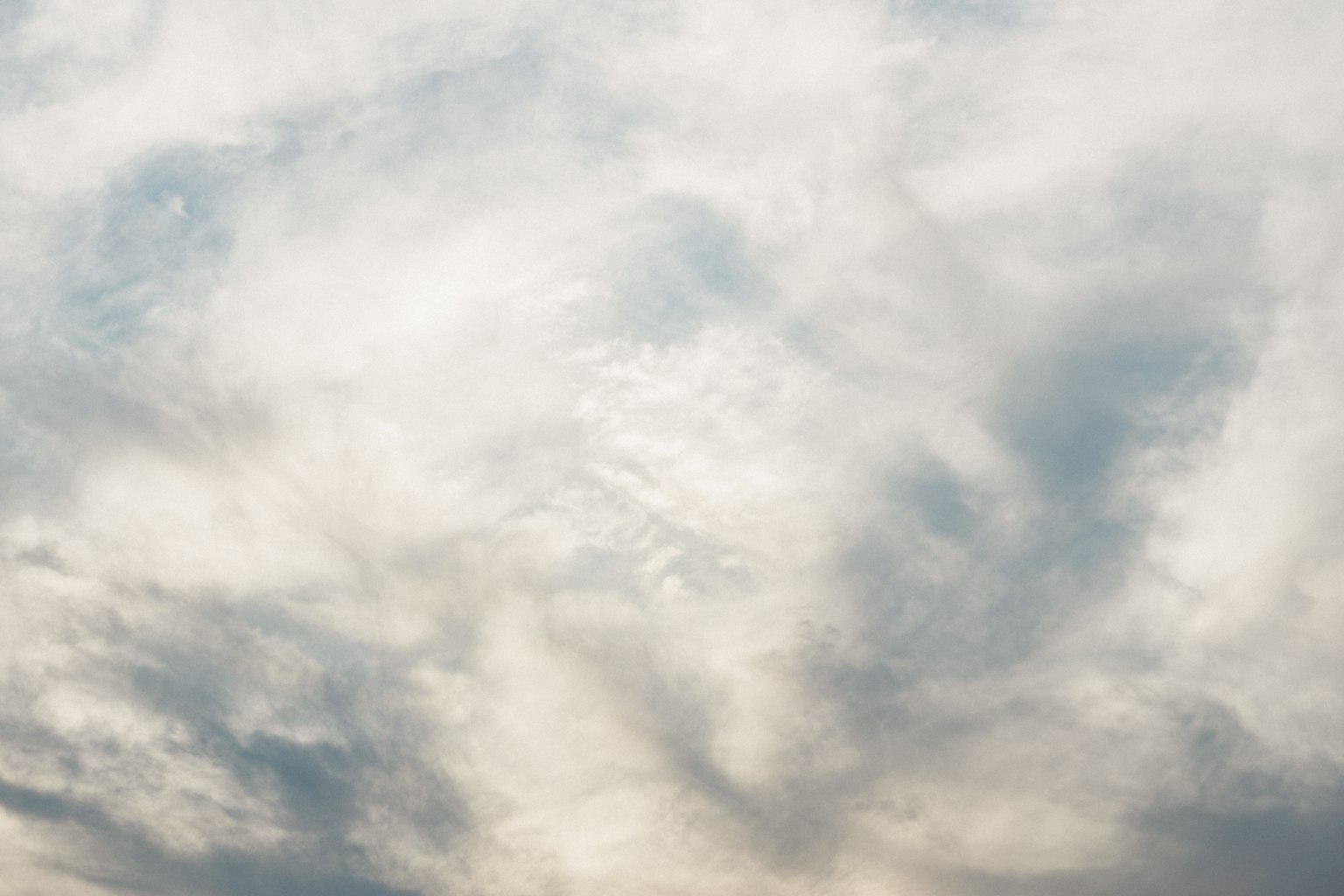 A sky filled with soft blue and white clouds