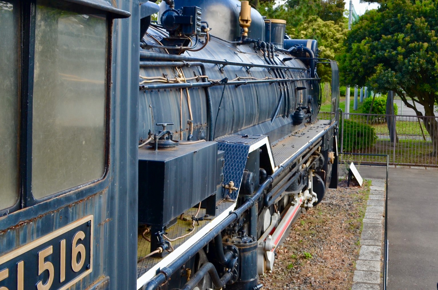 Side view of a blue steam locomotive showcasing intricate details