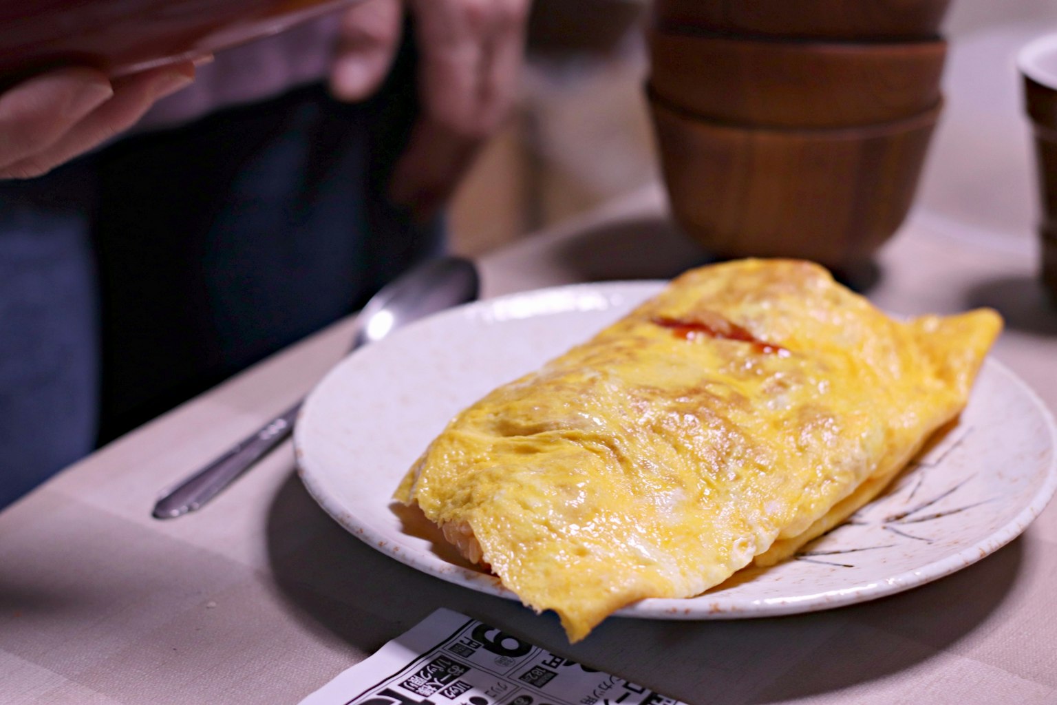 A delicious omelet served on a white plate