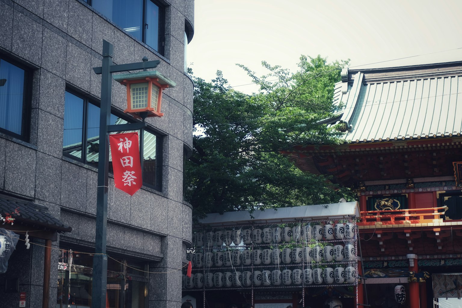Modern building near Kanda Myojin with traditional Japanese temple architecture