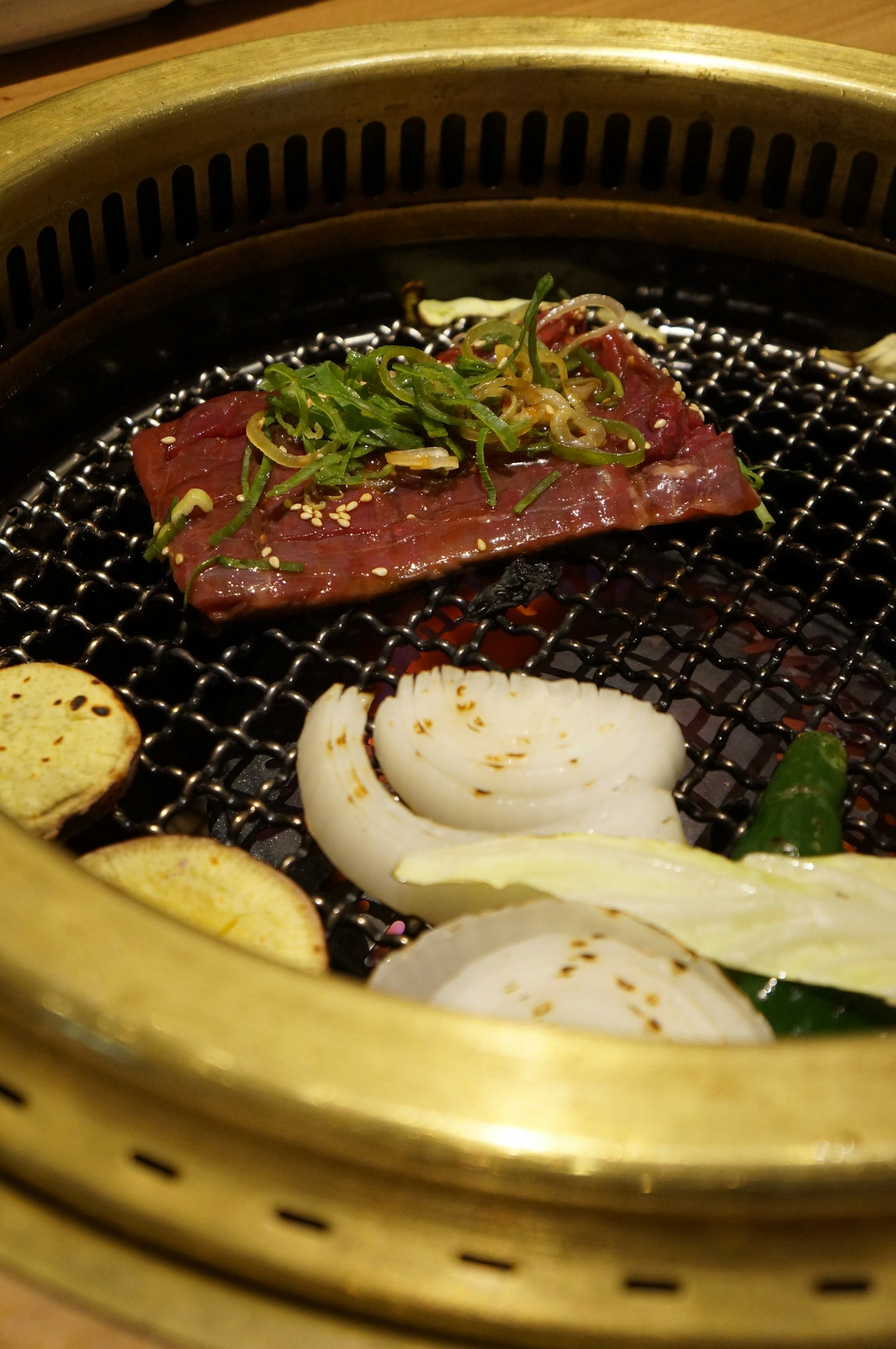 Grilled meat with vegetables on a barbecue grill