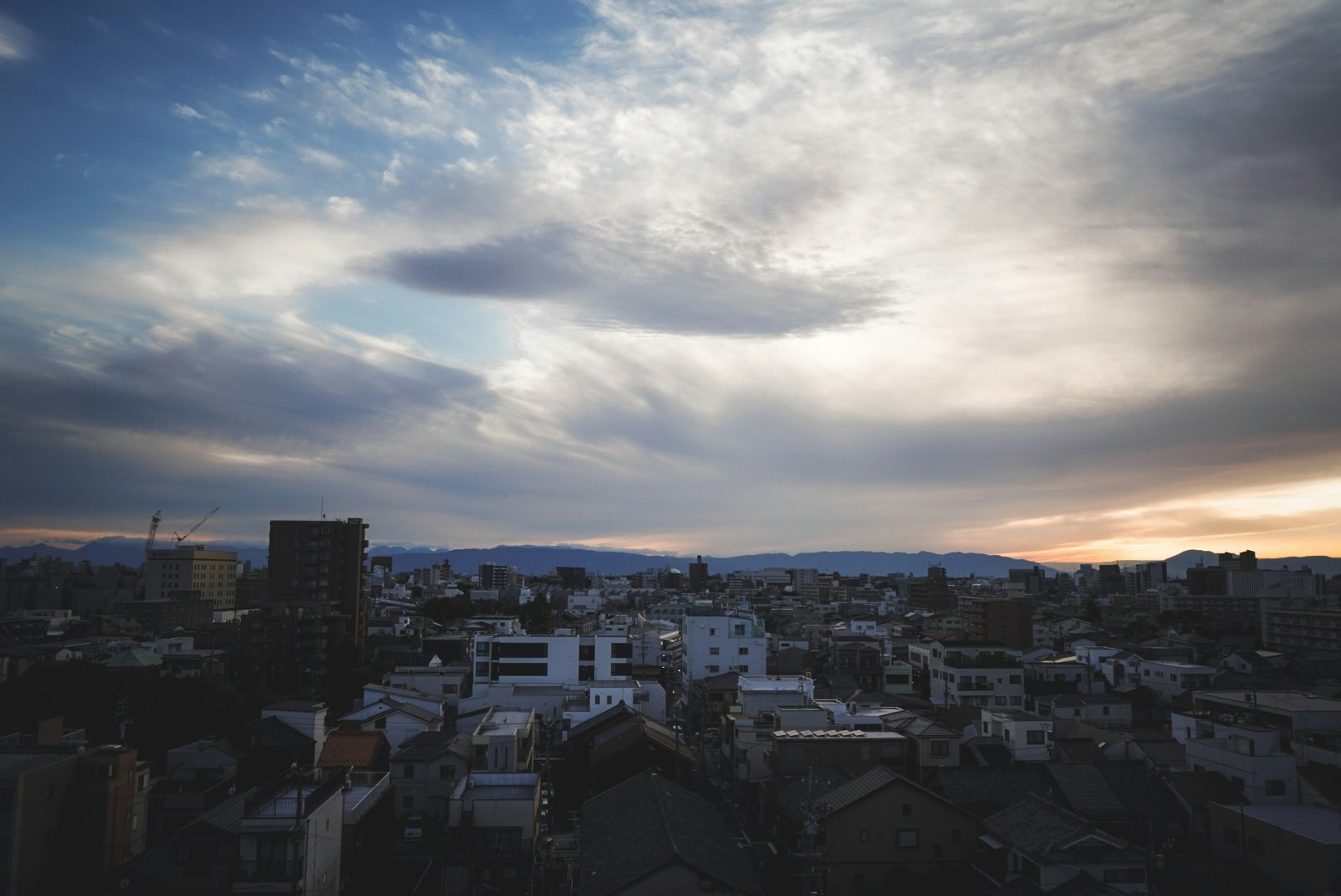 city panorama overlooking rooftops at dusk