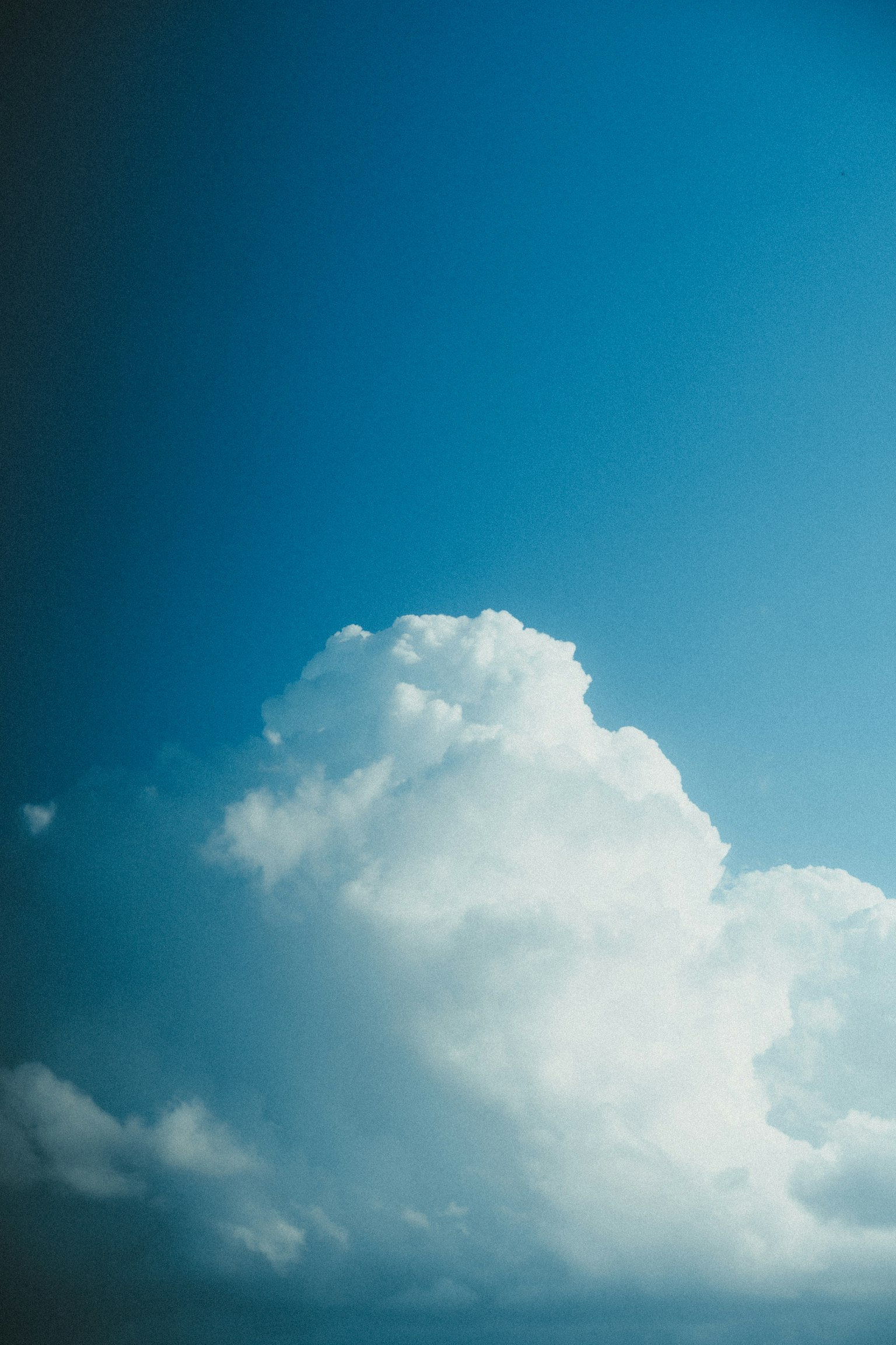 Close-up of a white cloud against a blue sky