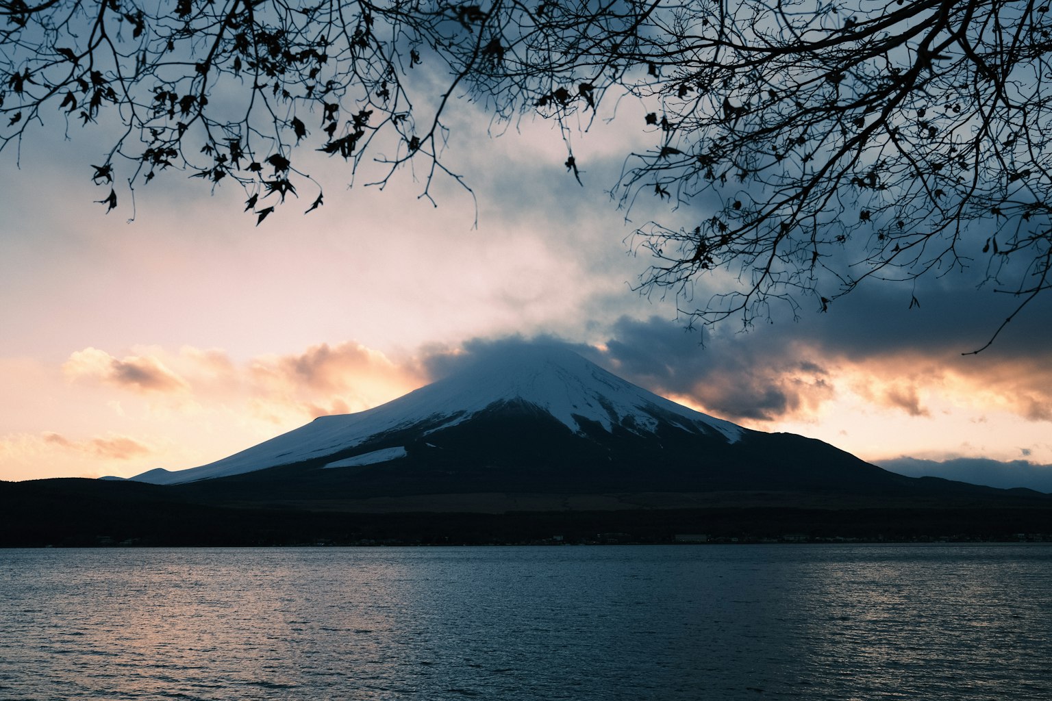 Beautiful view of Mount Fuji with evening clouds and reflections on the lake