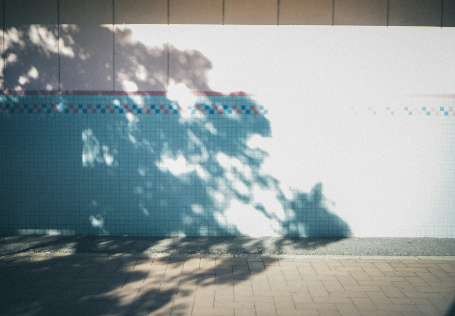 Simple scene with shadows cast on a blue wall