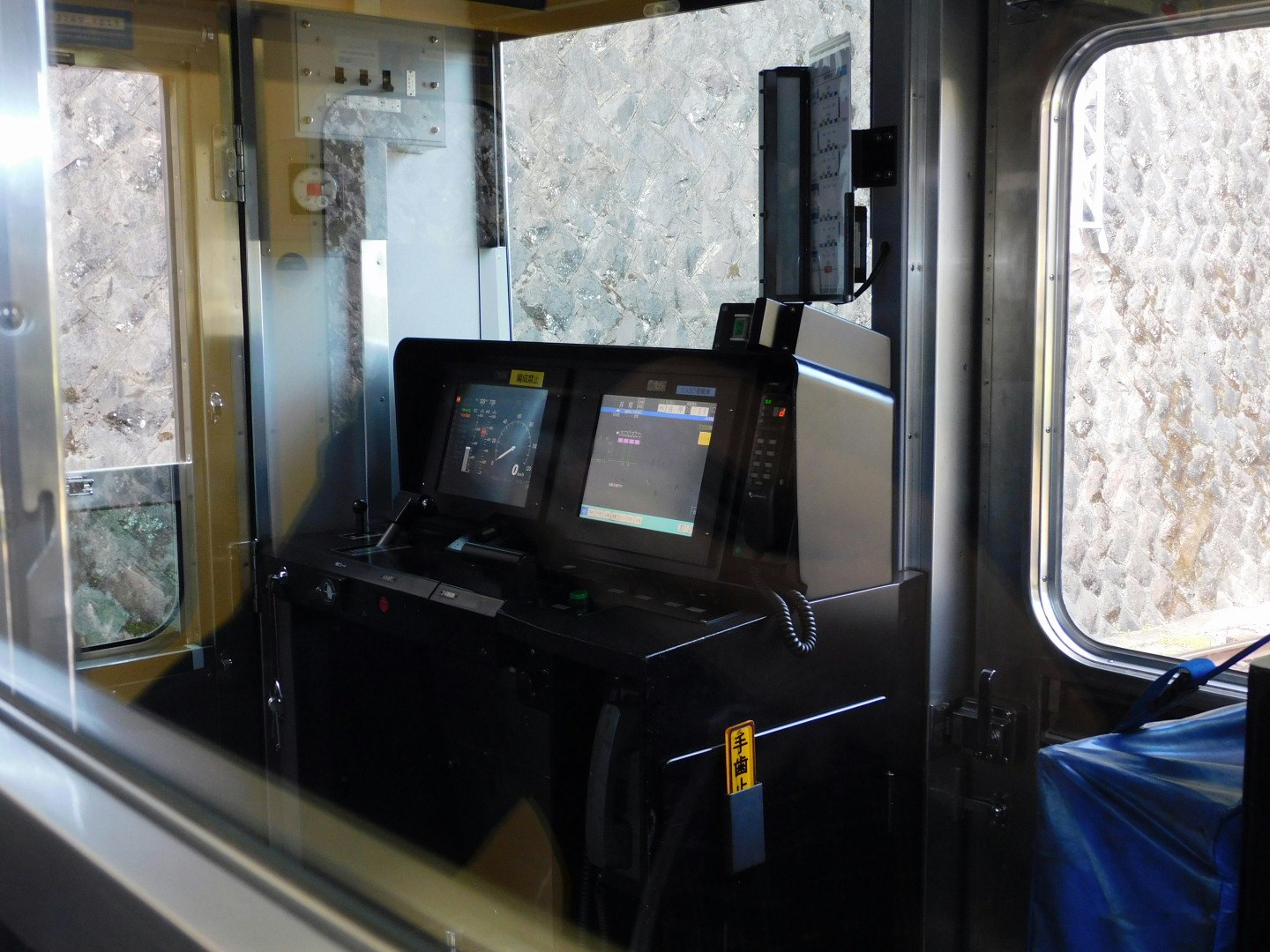View of a driver’s cab control panel and instruments inside a train car