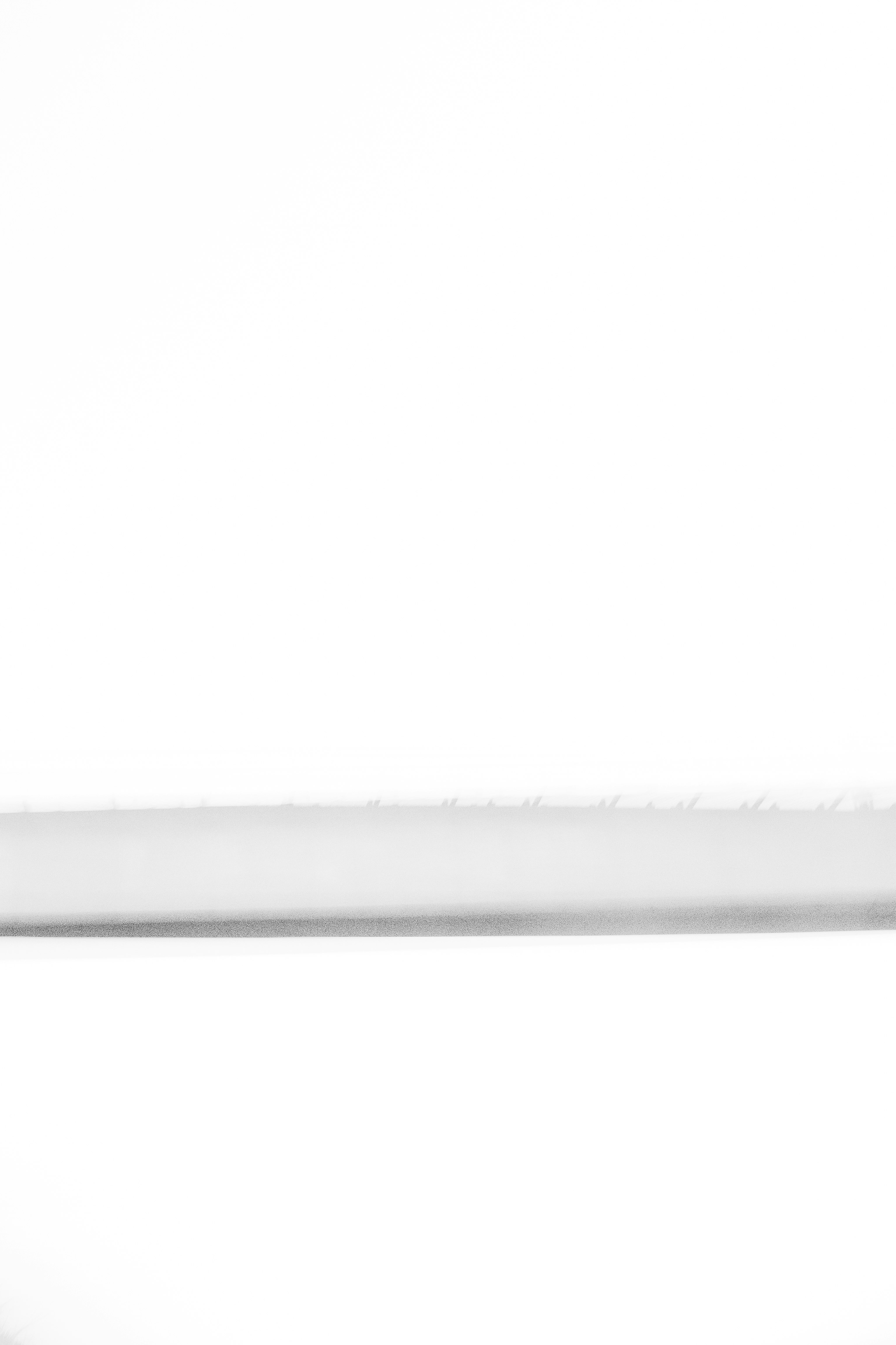 long thin shadow band on a white background