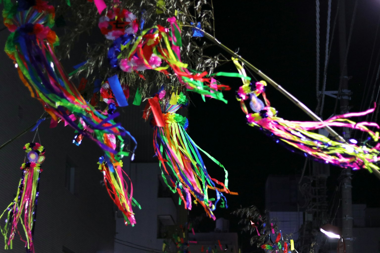 Colorful ribbons hanging in the night sky