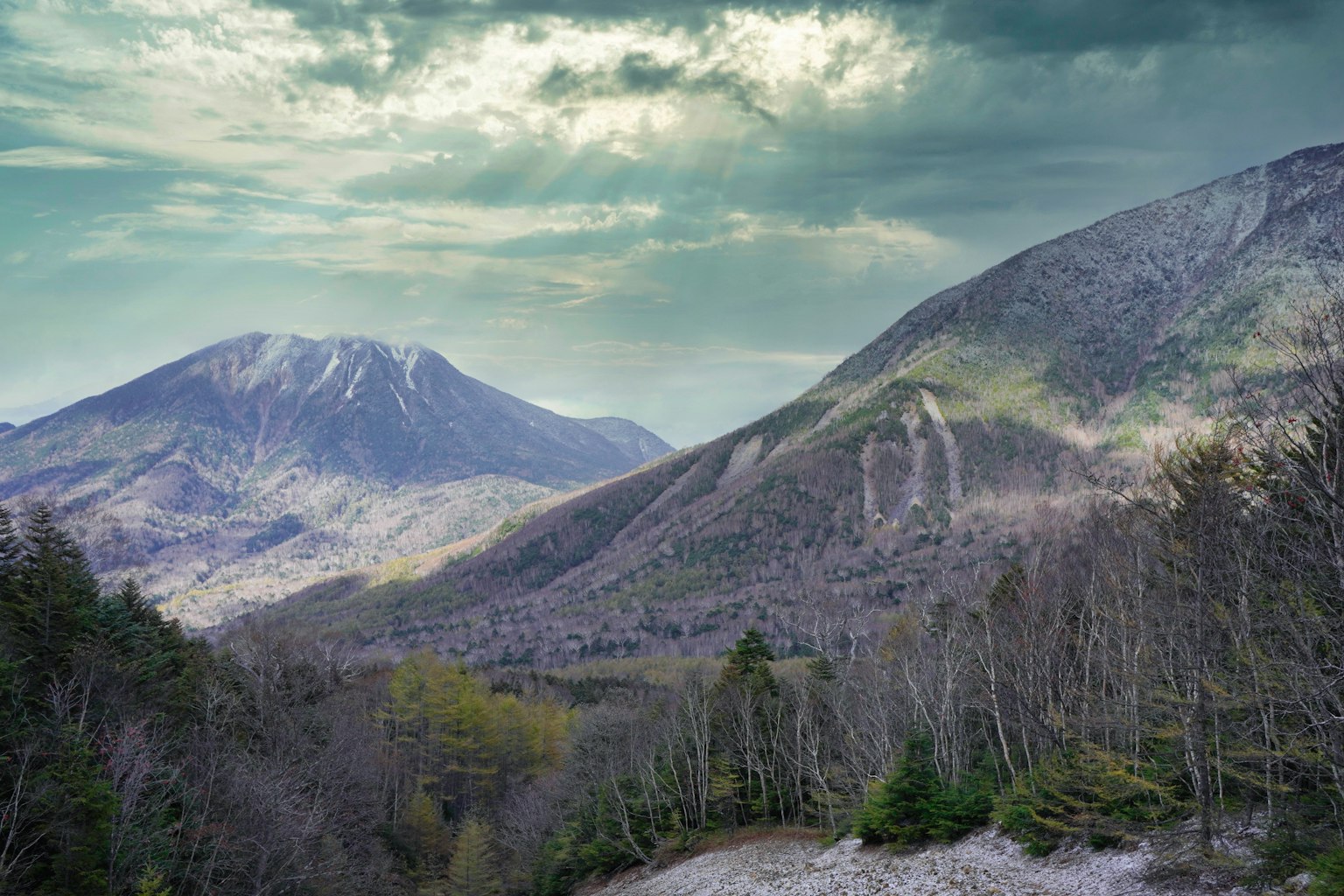 Lush green mountains with a cloudy sky