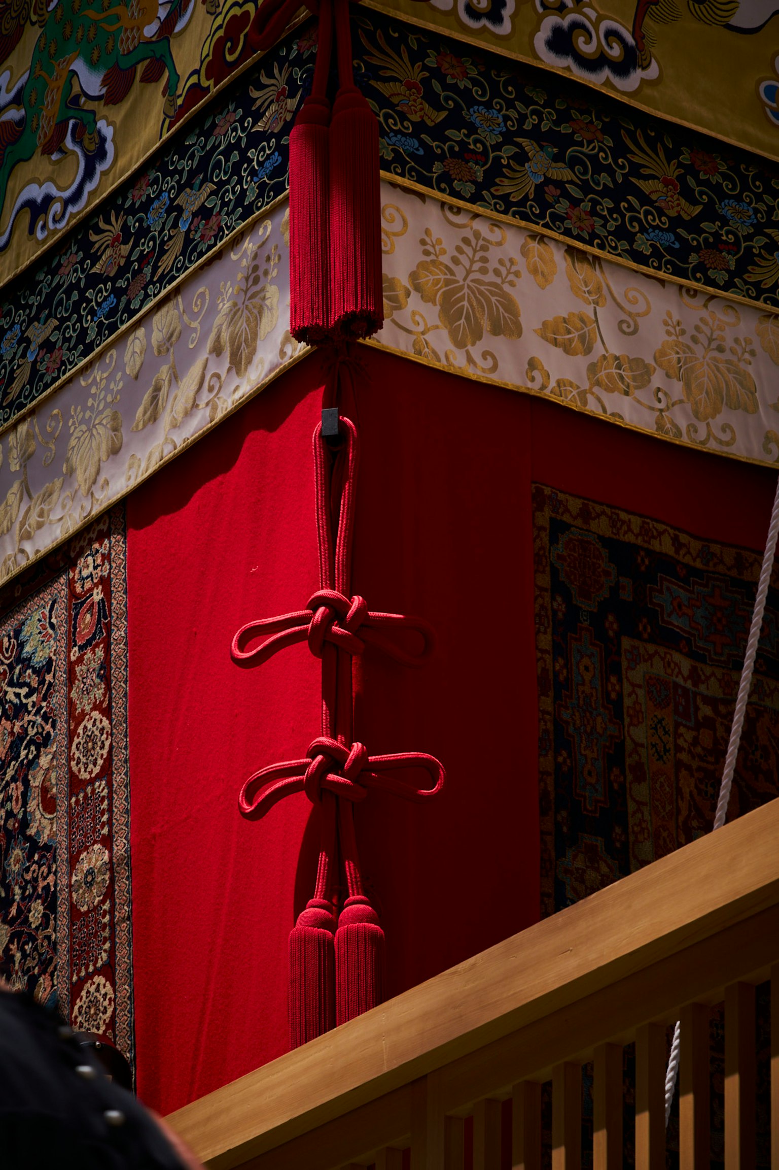 Traditional Japanese architectural detail featuring red fabric and decorative patterns