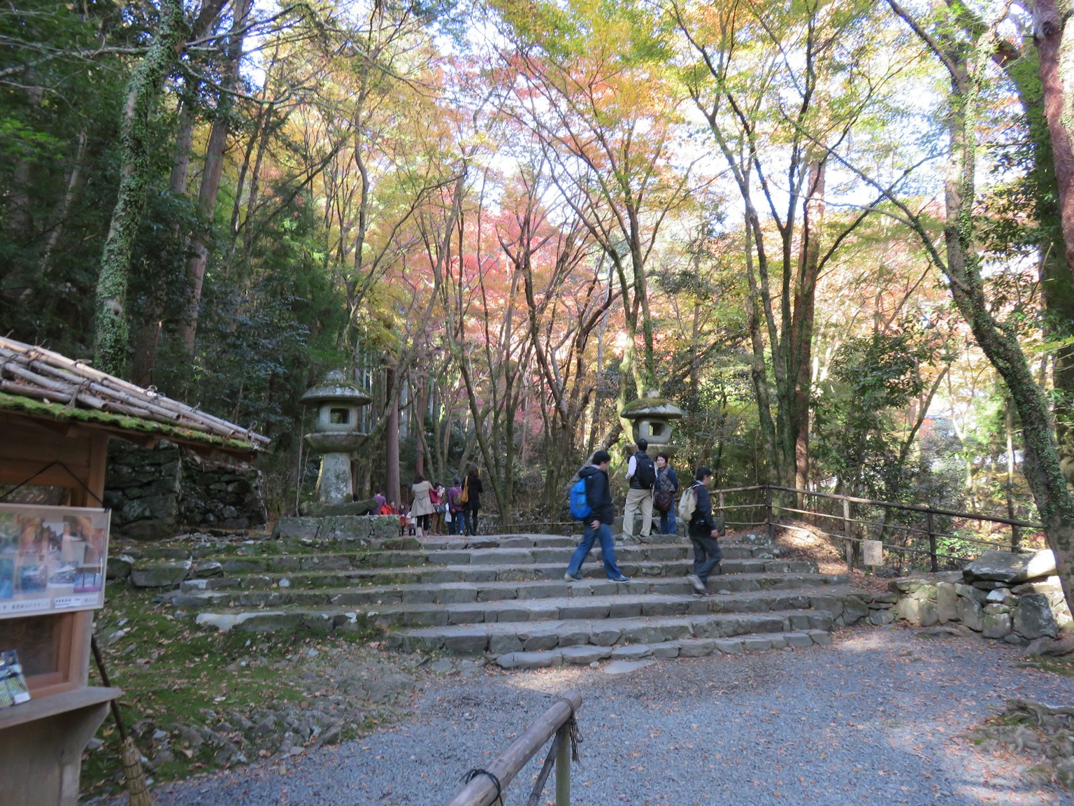 Scenic view with steps and stone lanterns surrounded by colorful autumn foliage