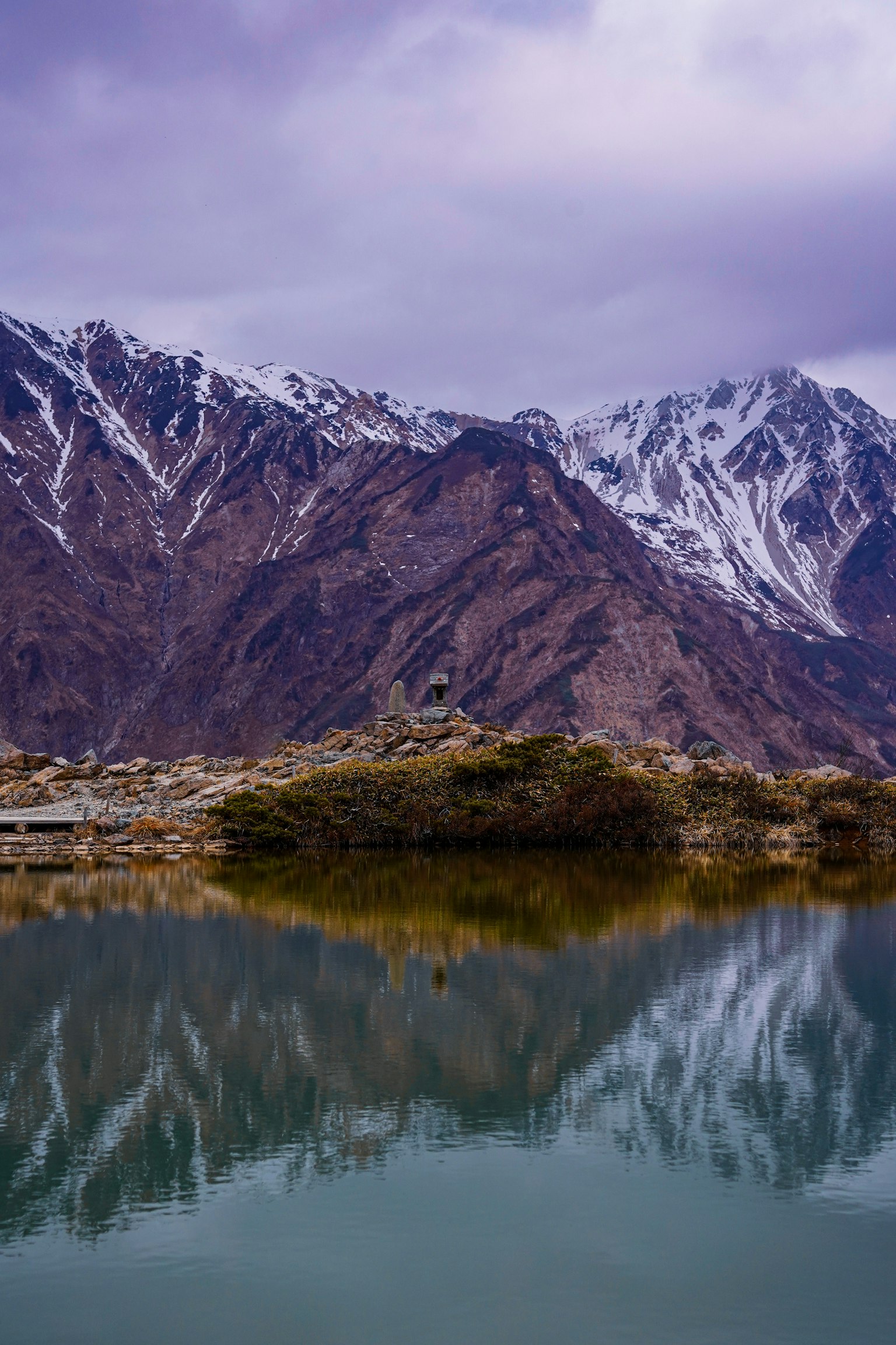 Scenic view of snow-capped mountains reflected in a tranquil lake