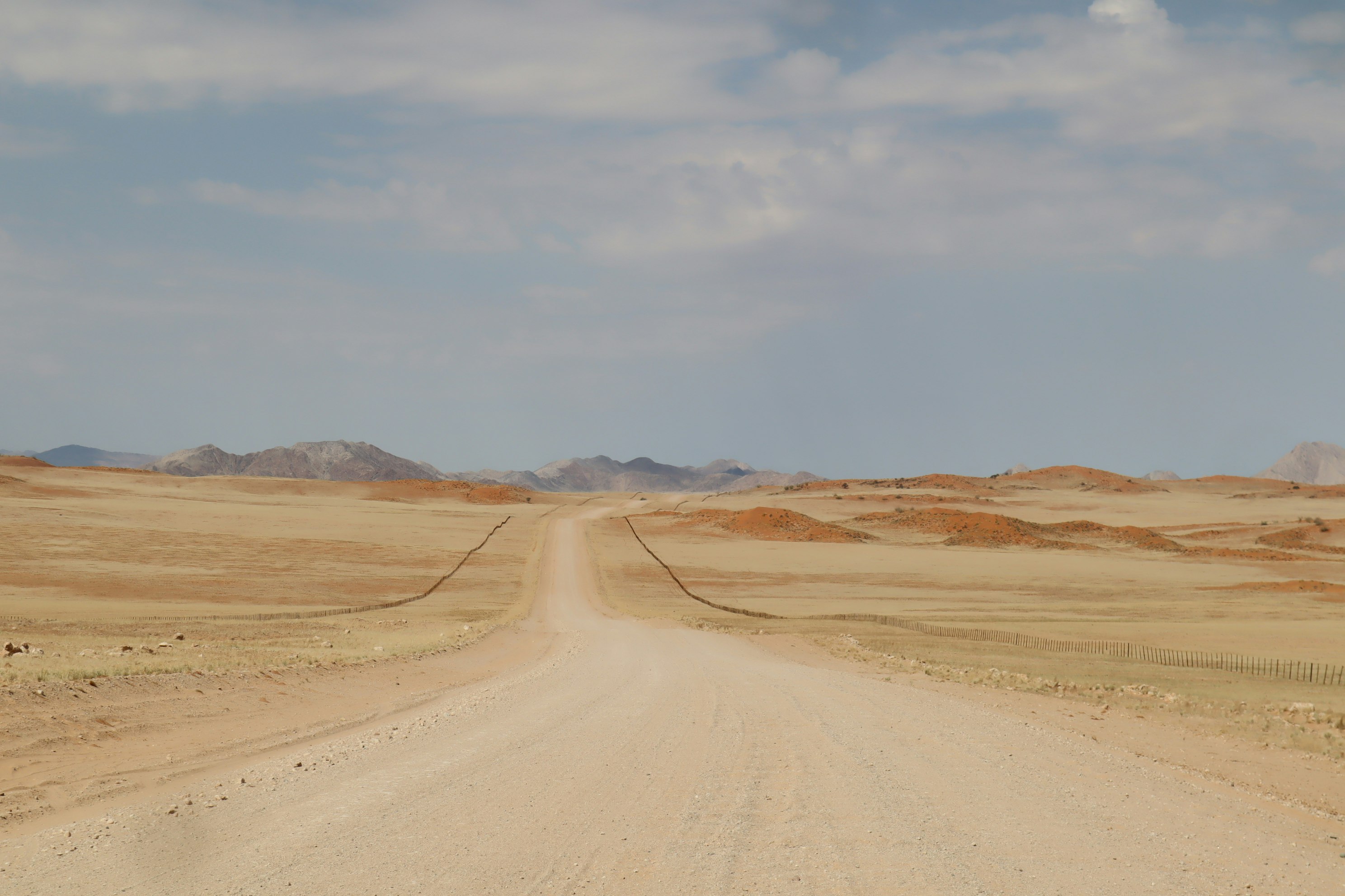A desert road stretching toward the horizon