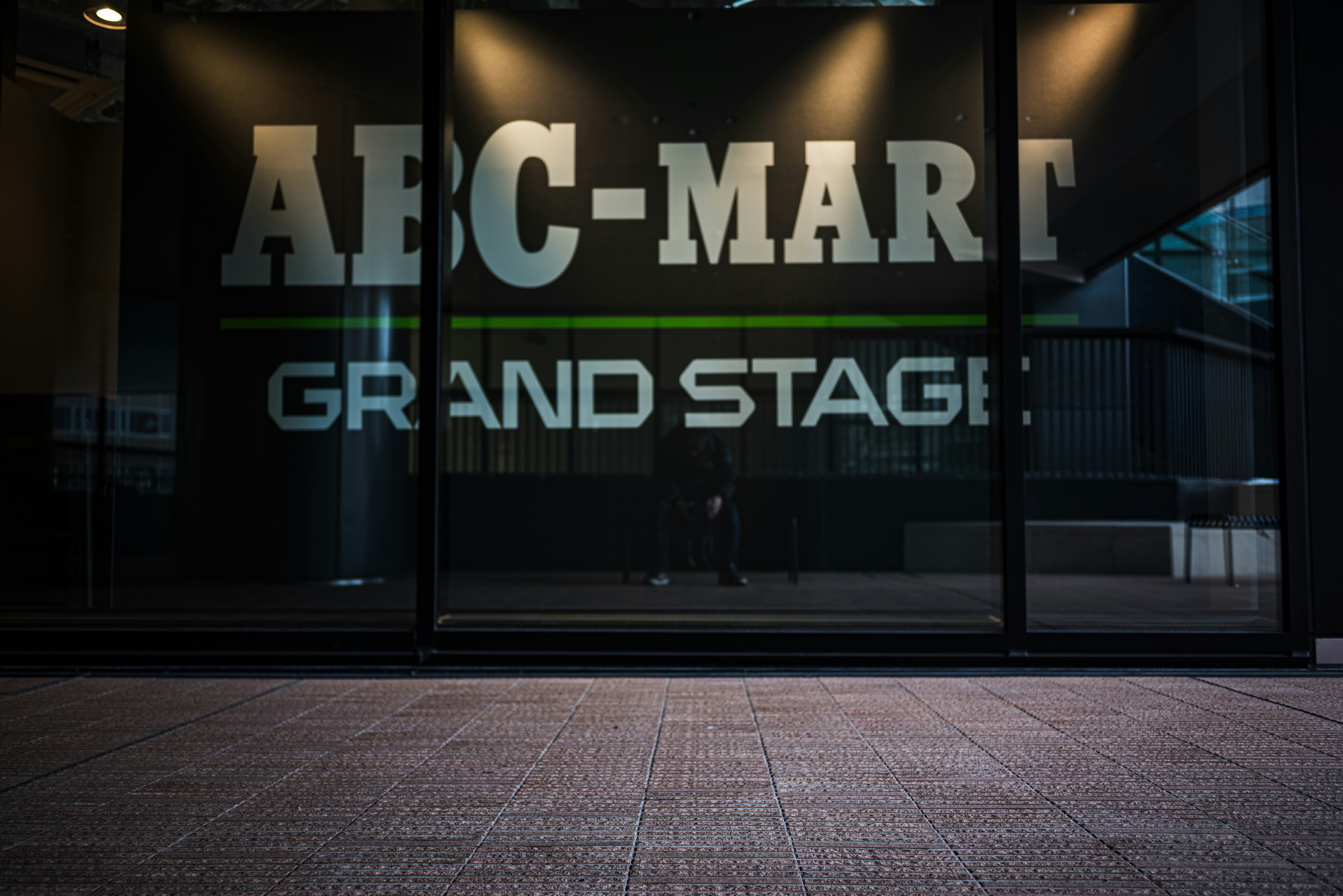 Indoor entrance with signage reading “ARC-MAR” and “GRAND STAGE”