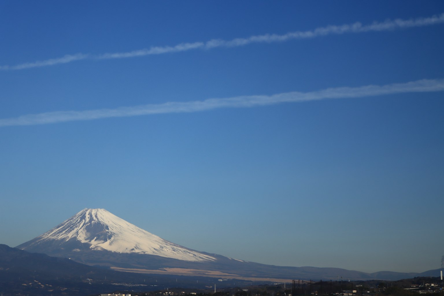 Snow-capped Mount Fuji under a clear blue sky